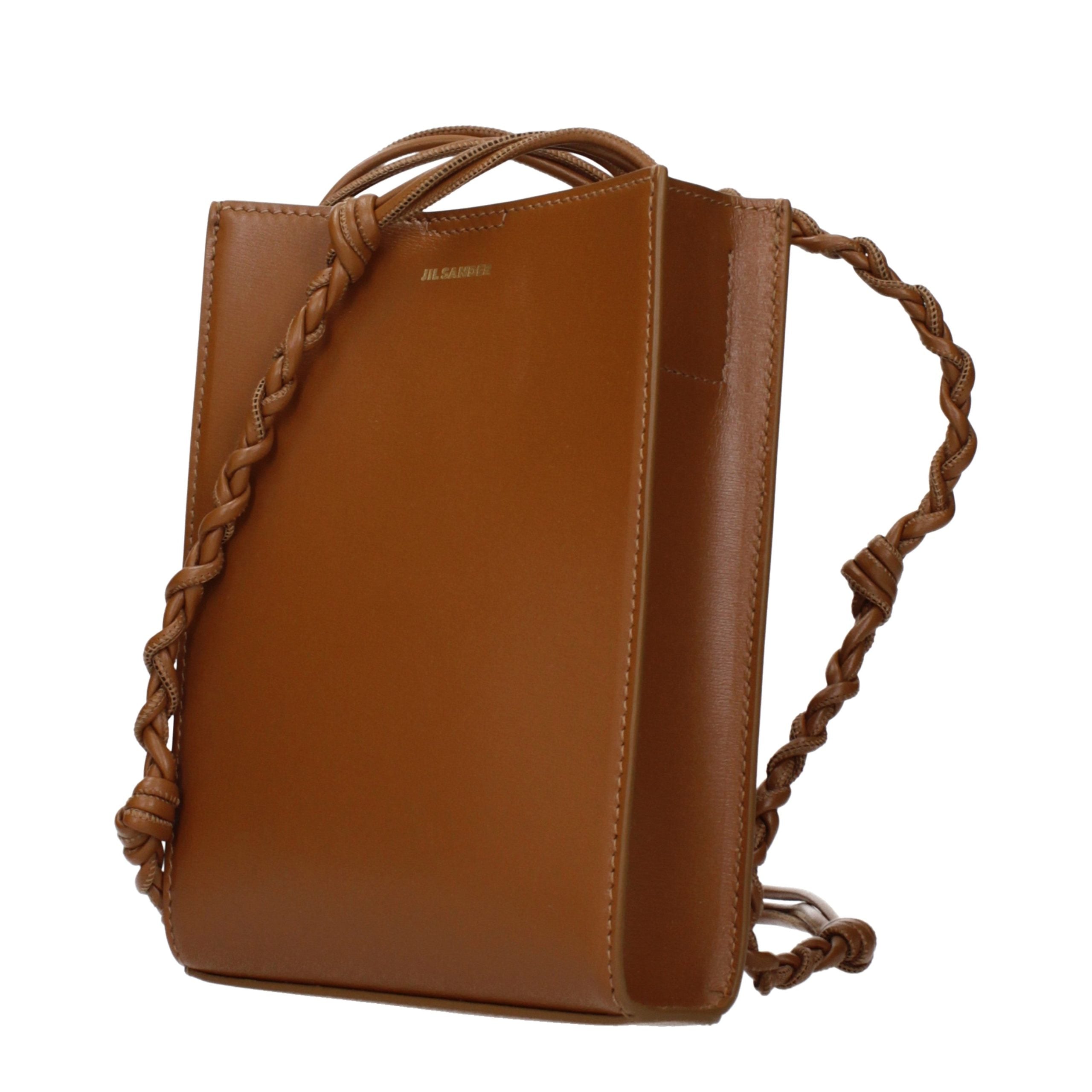 Indulge in the exquisite allure of the Jil Sander Brown Leather Crossbody Bag, a testament to refined craftsmanship and timeless elegance, perfect for the discerning individual.