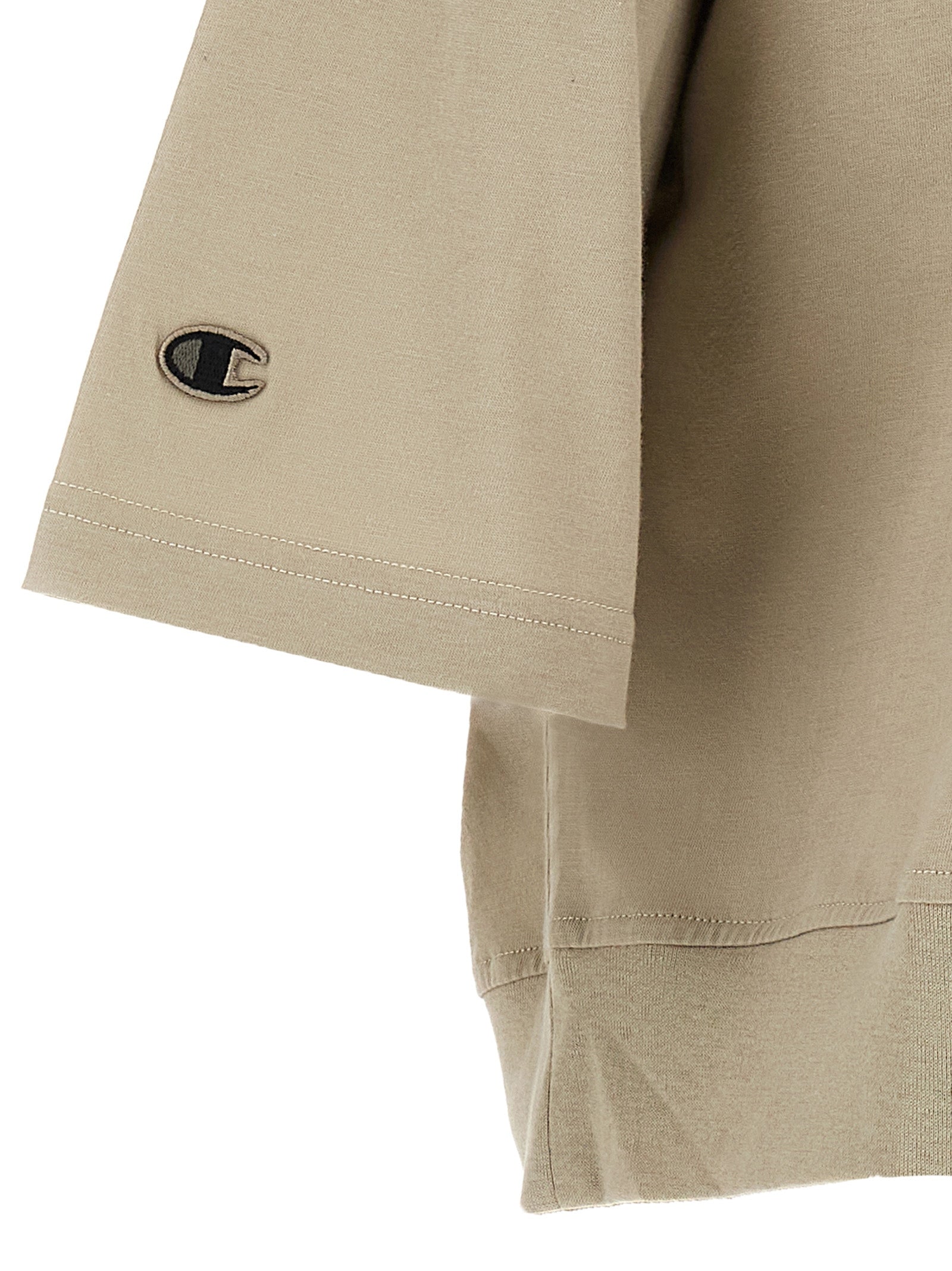 Discover the RICK OWENS x Champion Gray Cotton T-Shirt, a masterpiece of sustainable fashion that redefines casual elegance with its organic cotton and meticulous design.
