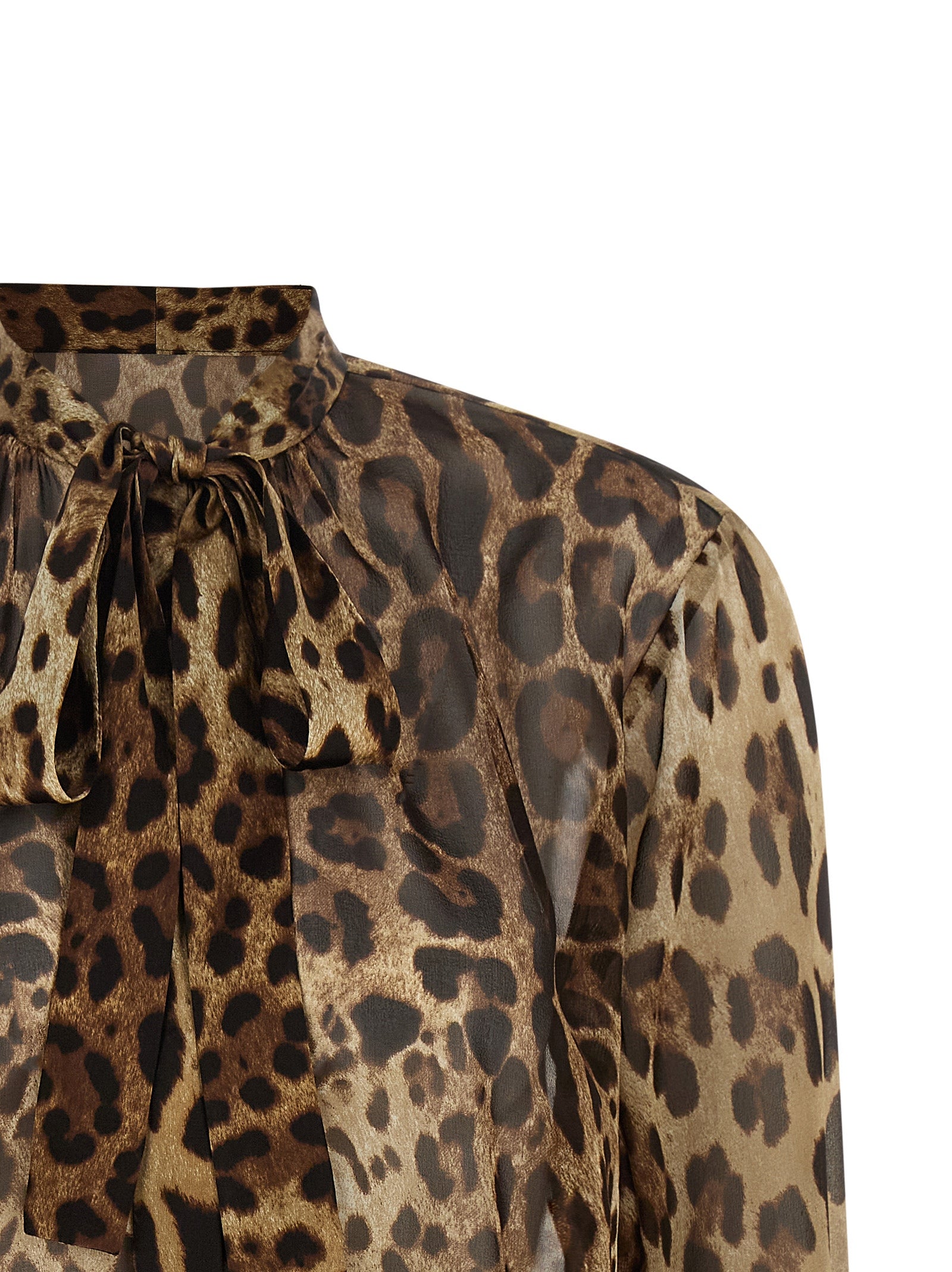 Indulge in the allure of the Dolce & Gabbana Brown Silk Blouse, a masterpiece of silk georgette adorned with a captivating animal print, embodying elegance and sophistication.
