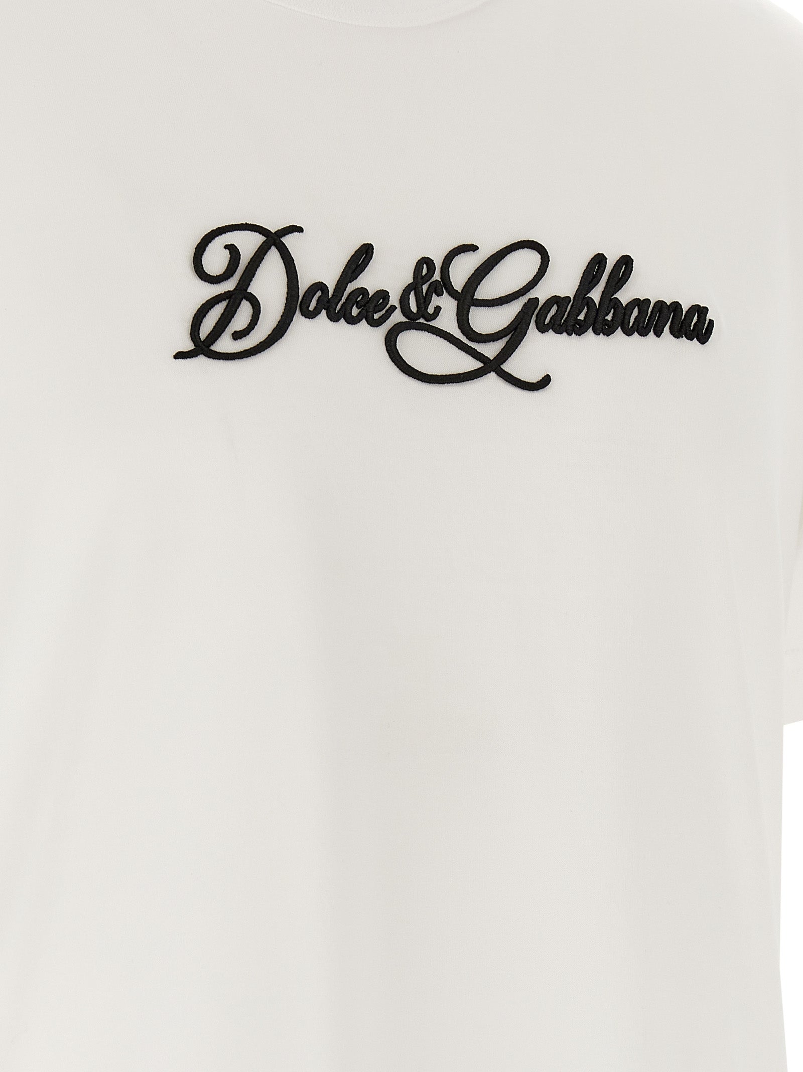 Discover the Dolce & Gabbana White Cotton T-Shirt, a symbol of Italian elegance, featuring exquisite craftsmanship and an iconic embossed logo for timeless sophistication.