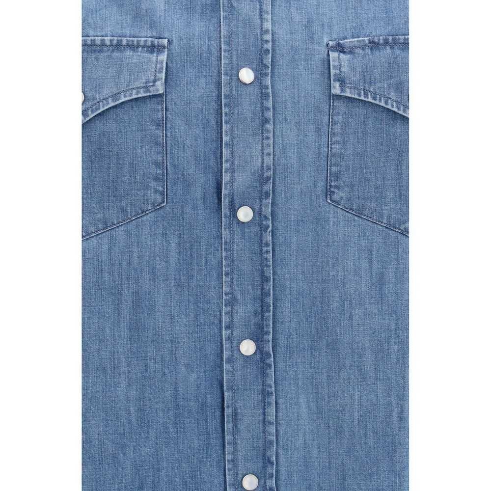 Discover the Brunello Cucinelli Blue Denim Shirt, a masterpiece of effortless elegance crafted from lightweight cotton, perfect for the discerning individual who values sophistication.
