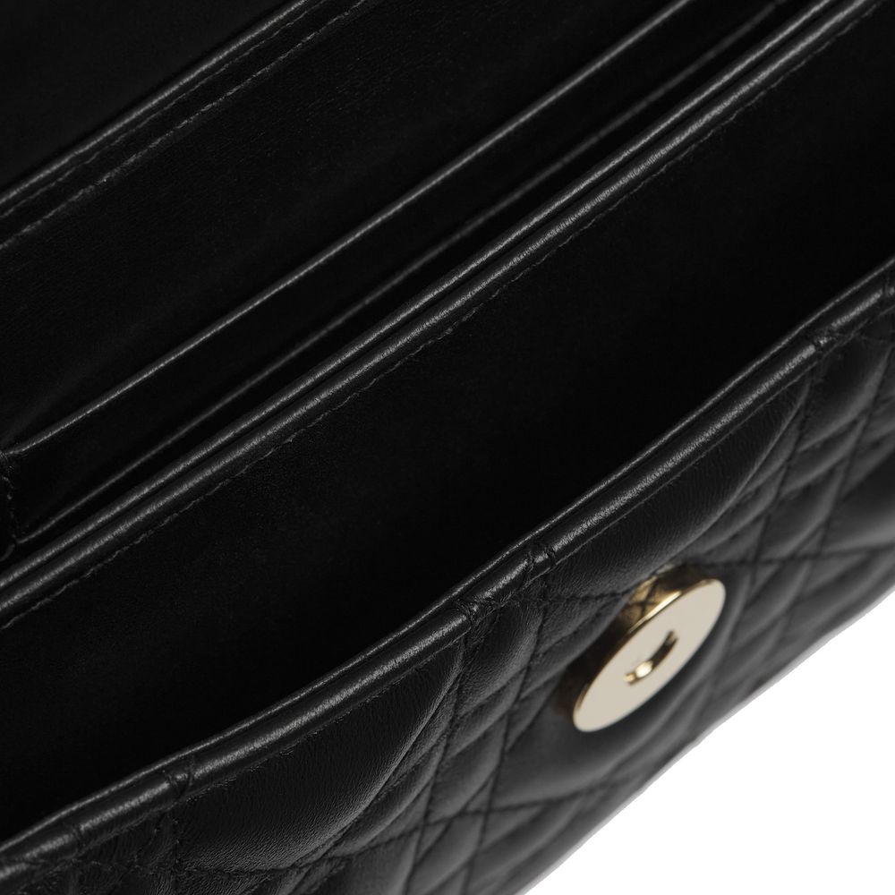 Indulge in the elegance of the Dior Black Leather Shoulder Bag, a masterpiece of Italian craftsmanship with quilted lambskin and gold-tone accents, perfect for the discerning connoisseur.