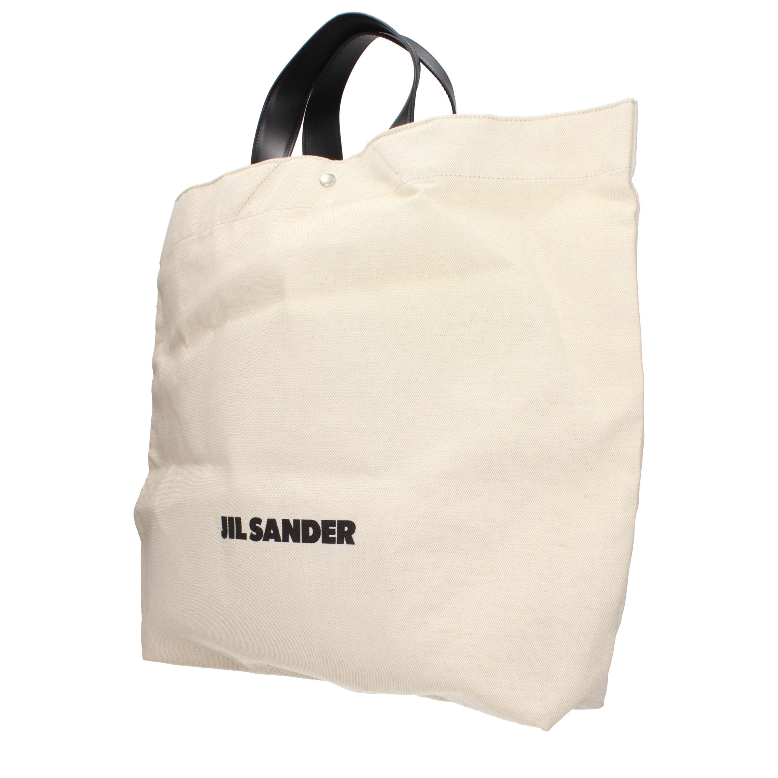 Indulge in the timeless elegance of the Jil Sander Beige Fabric Handbag, a masterpiece of vintage allure and sophisticated design, perfect for the discerning connoisseur.