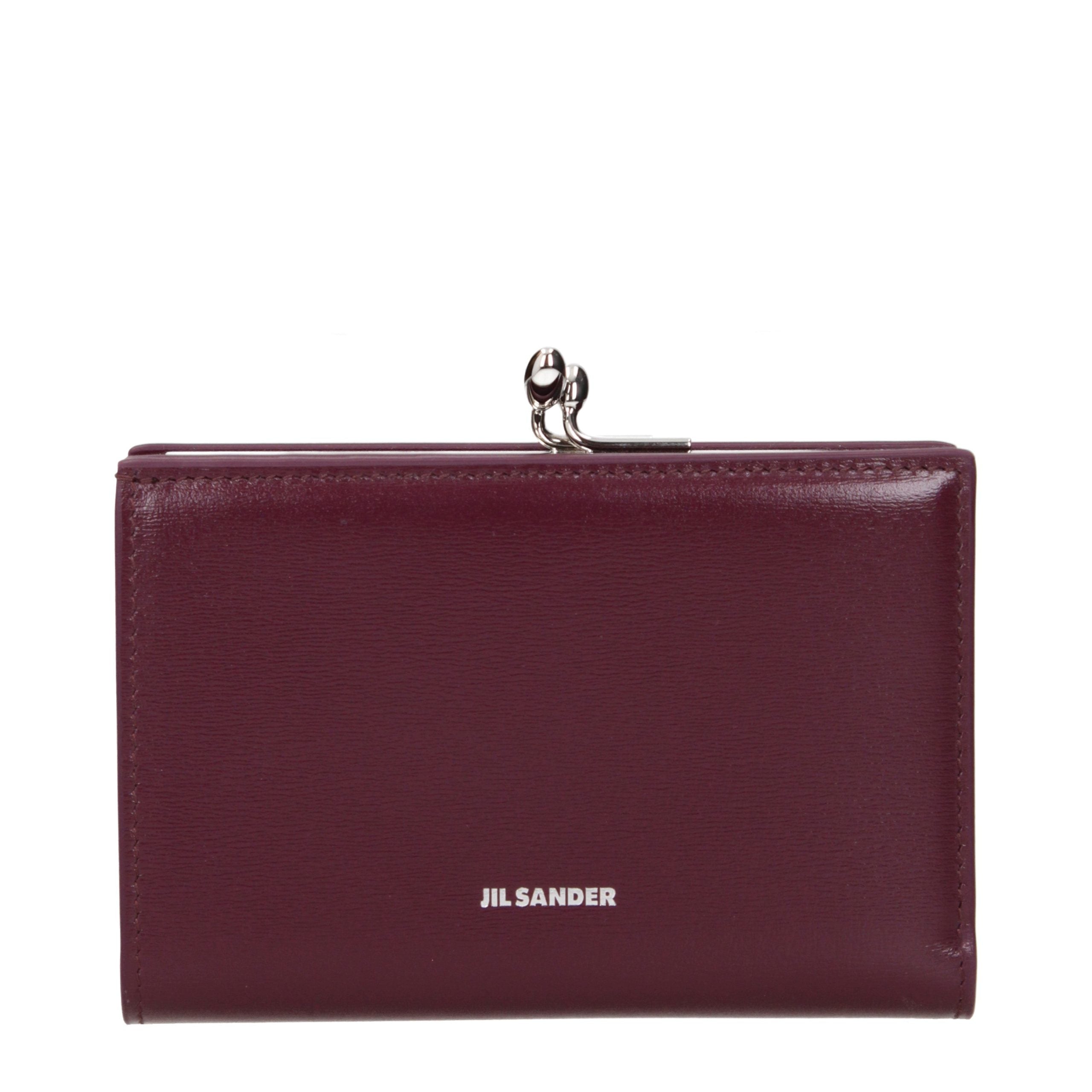 Indulge in the exquisite allure of the Jil Sander Red Leather Wallet, a symbol of refined elegance and timeless craftsmanship, perfect for the discerning connoisseur.