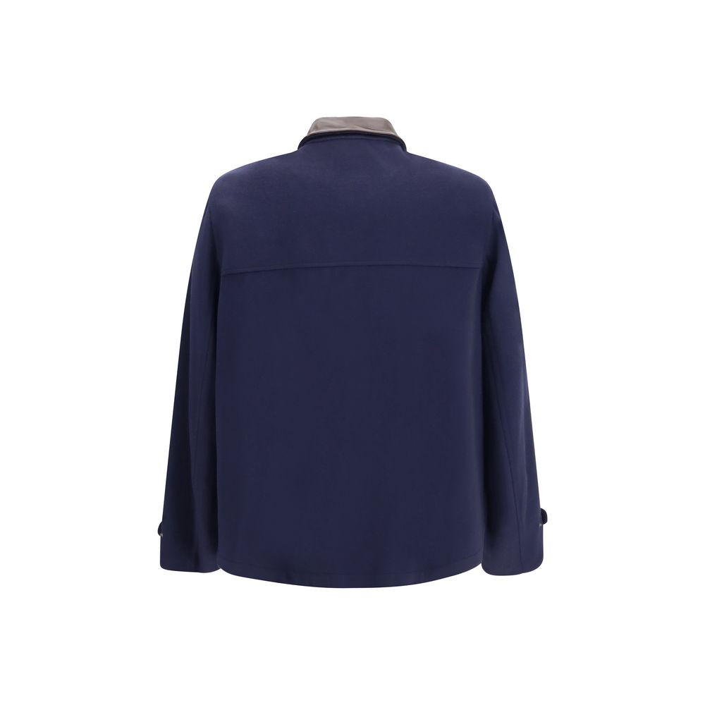 Indulge in the exquisite Brunello Cucinelli Blue Wool Oves Aries Full-Length Jacket, a masterpiece of Virgin wool and nappa detailing, embodying timeless elegance and sophistication.