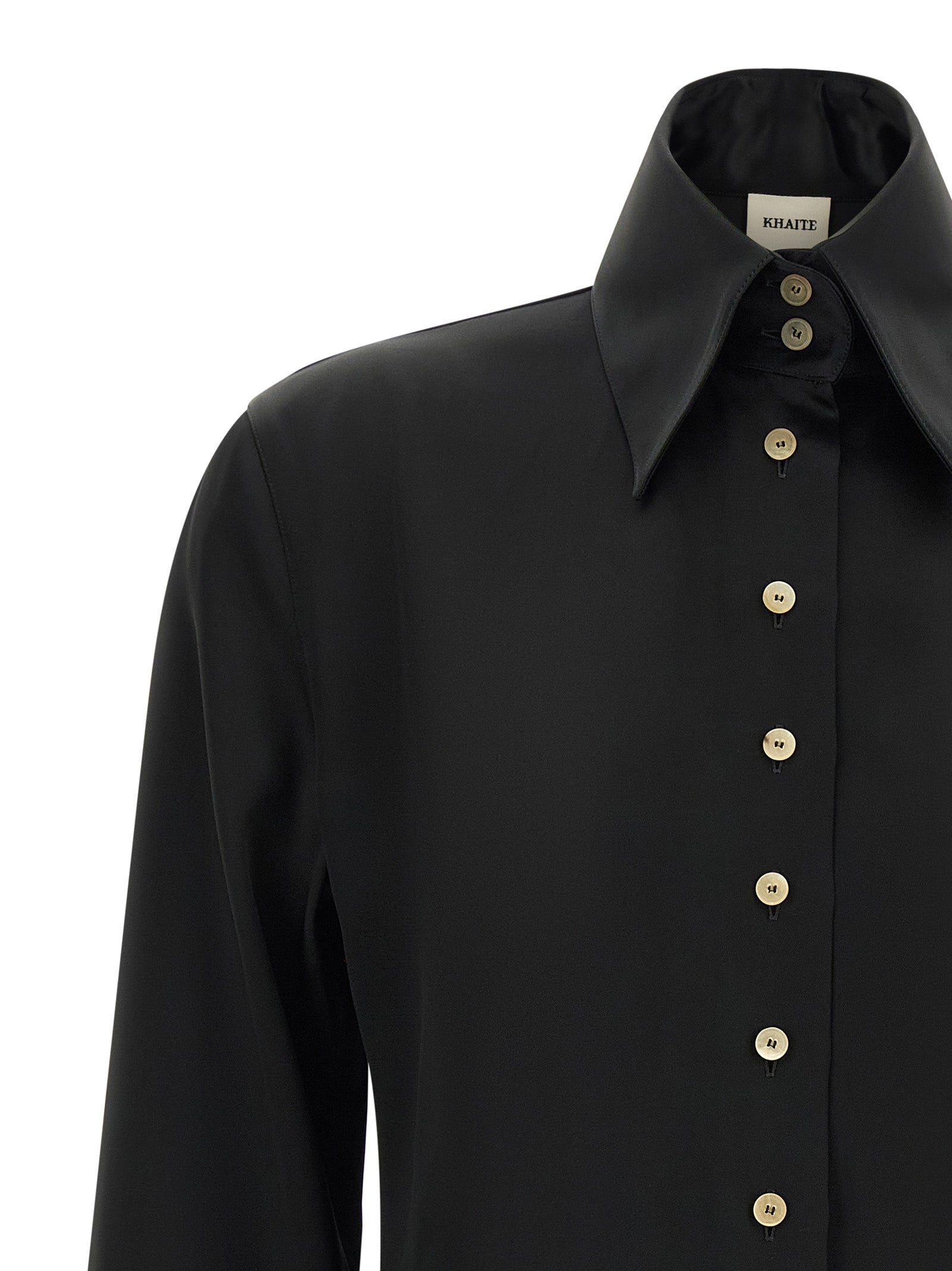 Experience the architectural elegance of the Khaite Black Acetate Blouse, crafted from a luxurious satin blend that redefines sophistication for the discerning individual.