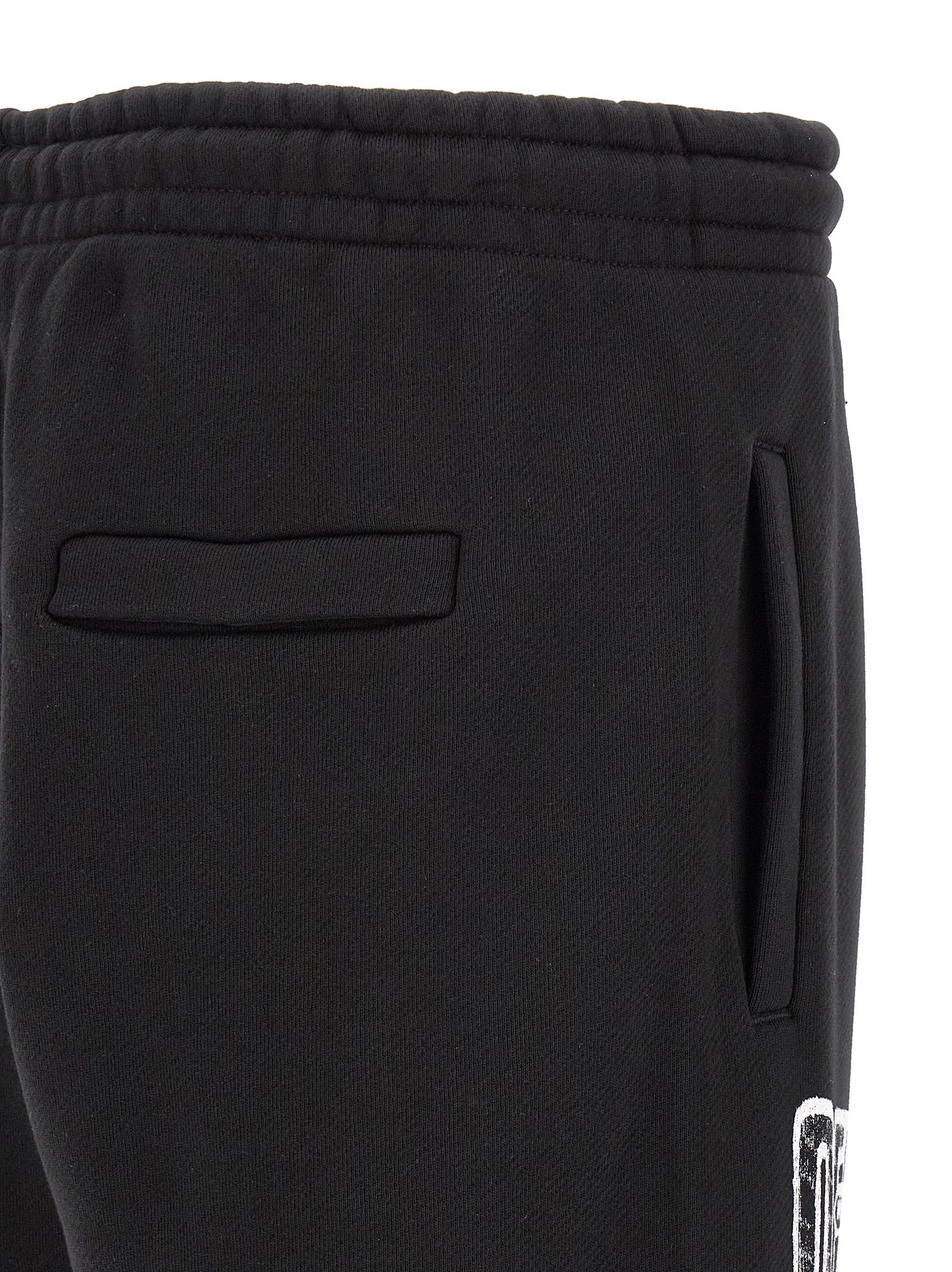 Elevate your streetwear with Off-White Black Cotton Joggers, crafted from luxurious 100% cotton, blending comfort and contemporary design for the discerning individual.
