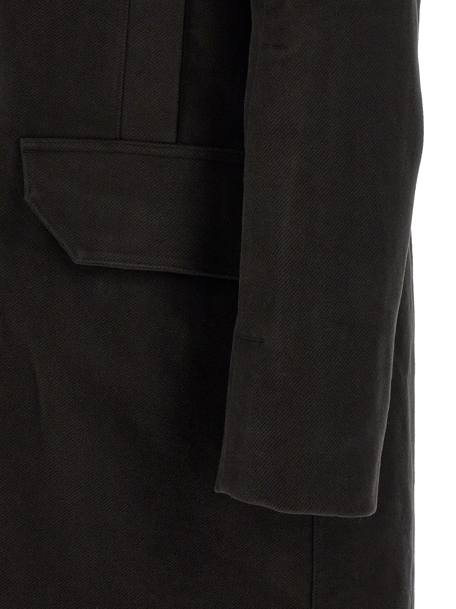 Discover the Rick Owens Black Cotton Parka, a masterpiece of architectural design and luxurious craftsmanship, perfect for those who command attention and embrace elegance.