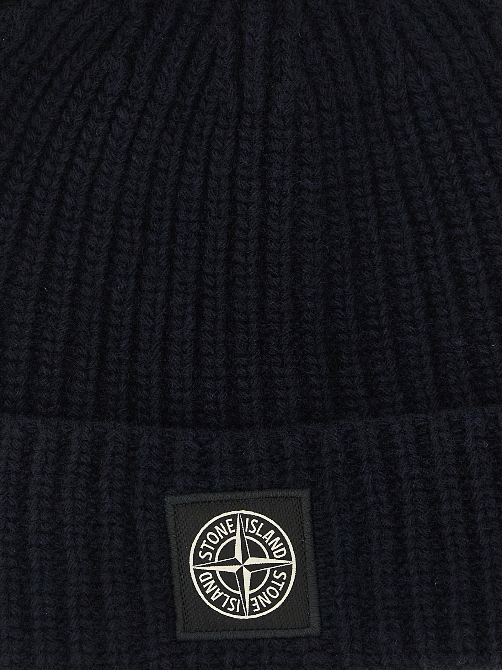 Elevate your winter ensemble with the Stone Island Blue Virgin Wool Beanie, a masterful blend of exquisite craftsmanship and timeless style, designed for the discerning individual.