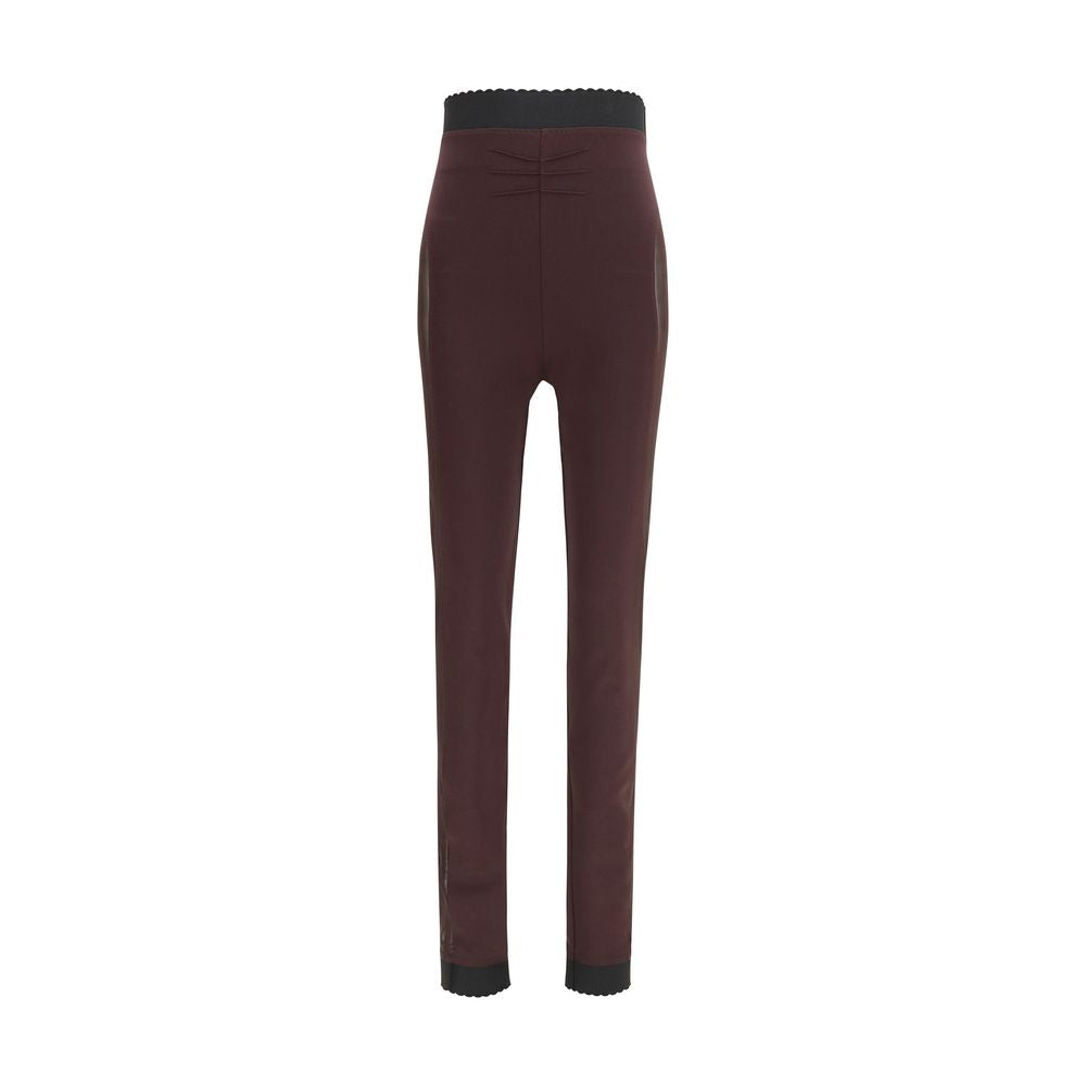 Elevate your wardrobe with The Attico Purple Viscose Leggings, featuring exquisite sheer details and a fitted silhouette, embodying luxury and sophistication for the discerning individual.