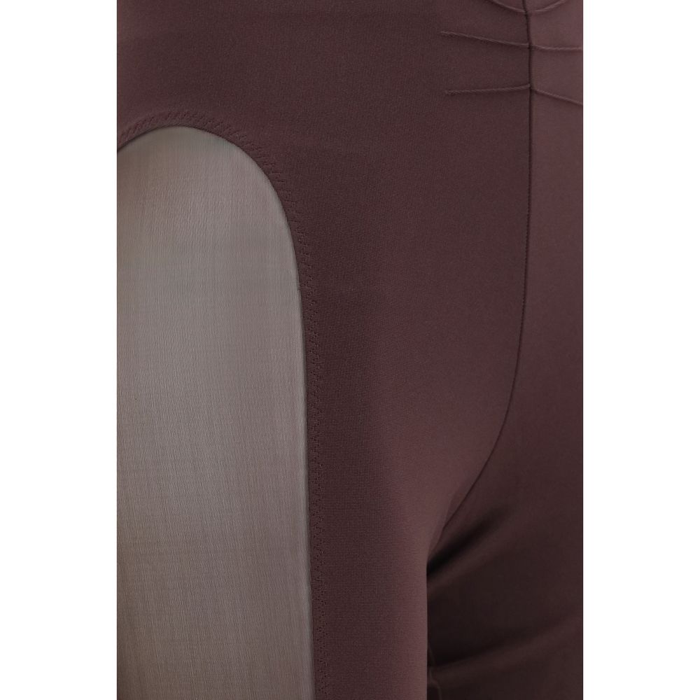 Indulge in the allure of The Attico's Purple Viscose Leggings, featuring exquisite sheer details and a fitted silhouette, embodying luxury and sophistication for the discerning wardrobe.