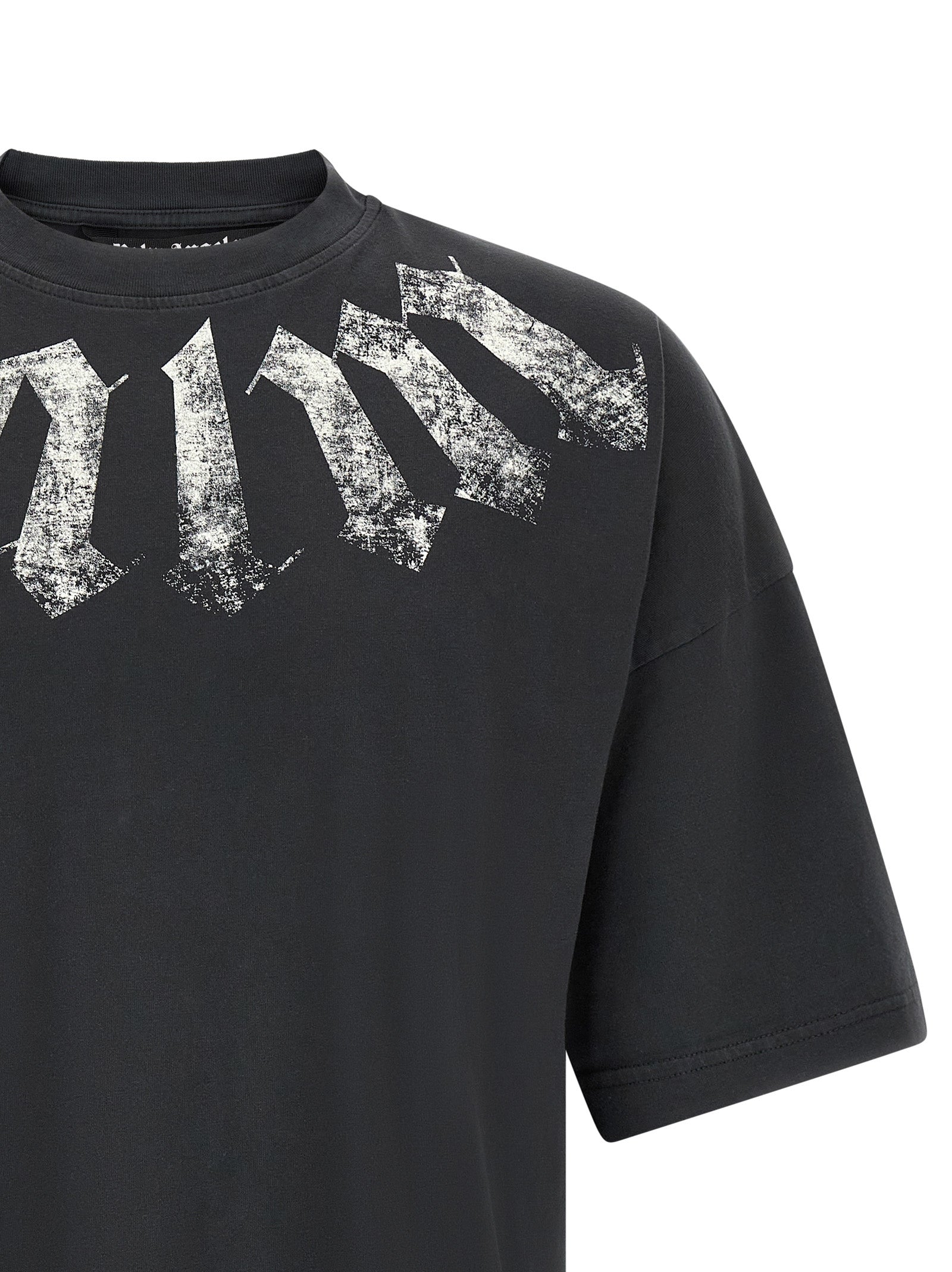 Elevate your wardrobe with the Palm Angels Black Cotton T-Shirt, a statement piece featuring a bold gothic print and luxurious comfort, perfect for discerning tastes.