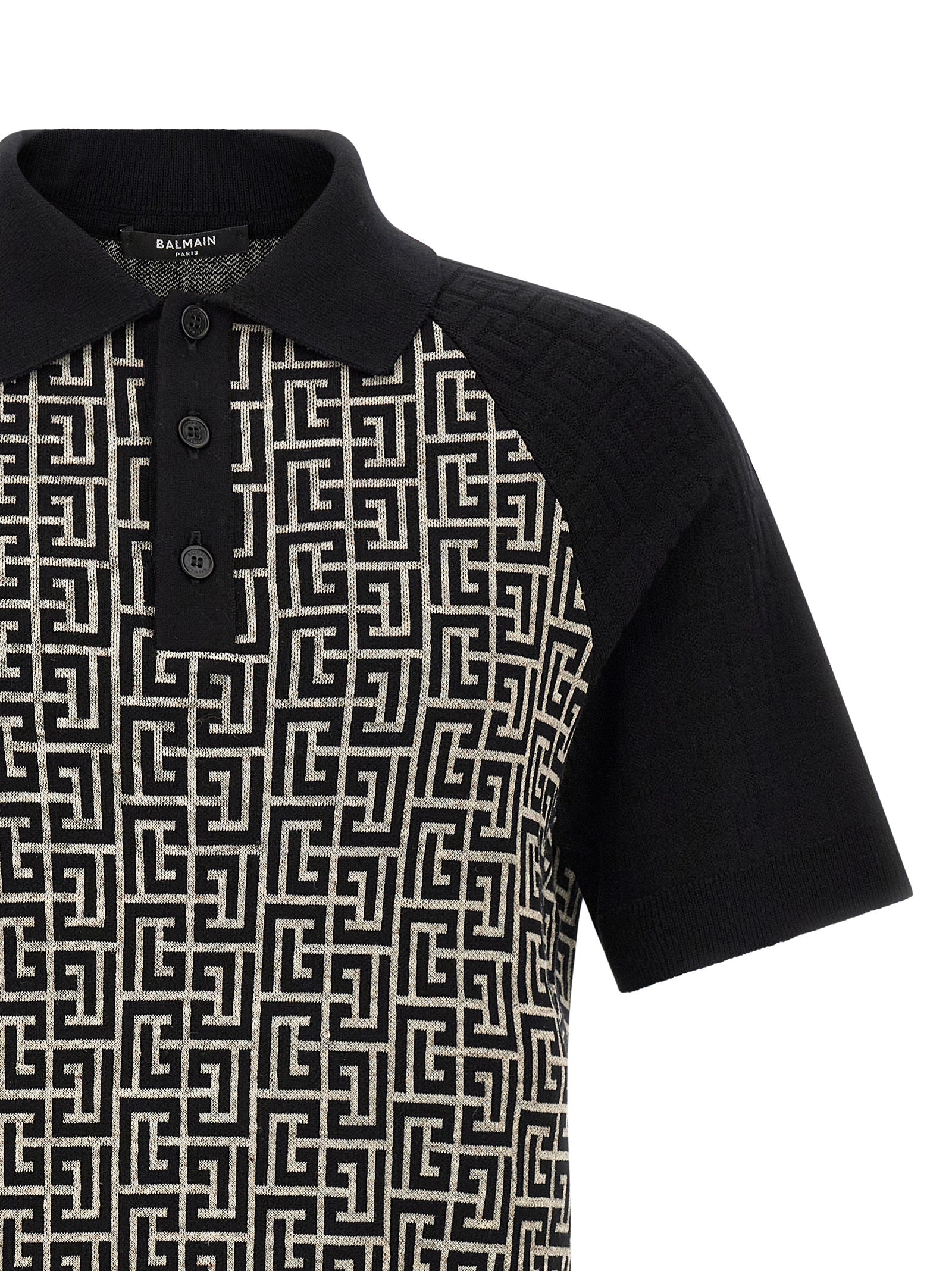 Elevate your wardrobe with the Balmain Bicolor Cotton Polo Shirt, a luxurious blend of cotton and linen, embodying timeless elegance and sophisticated style.