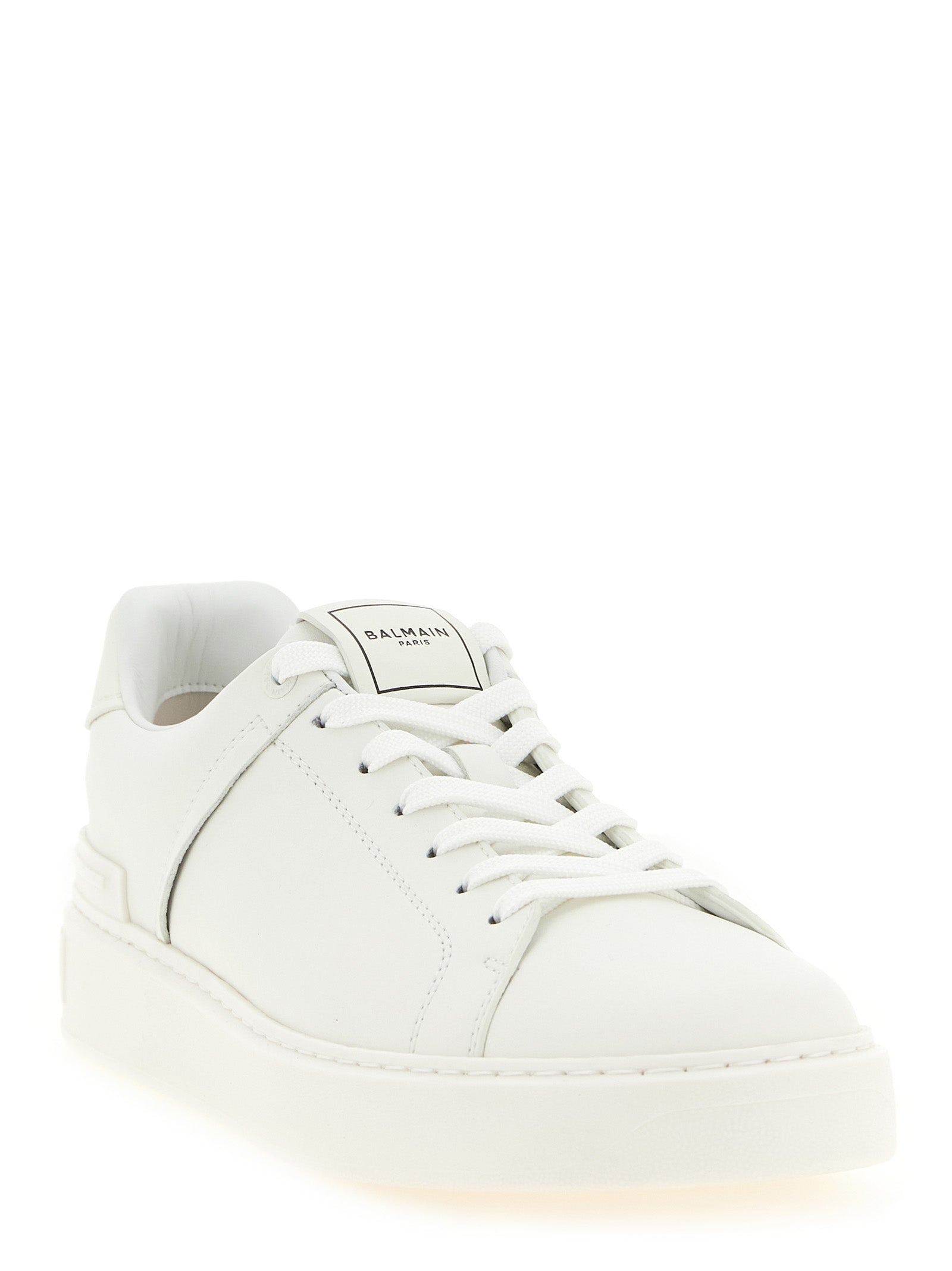 Elevate your style with Balmain's White Calfskin Low Top Sneakers, a fusion of exquisite craftsmanship and modern elegance, designed for the discerning individual.