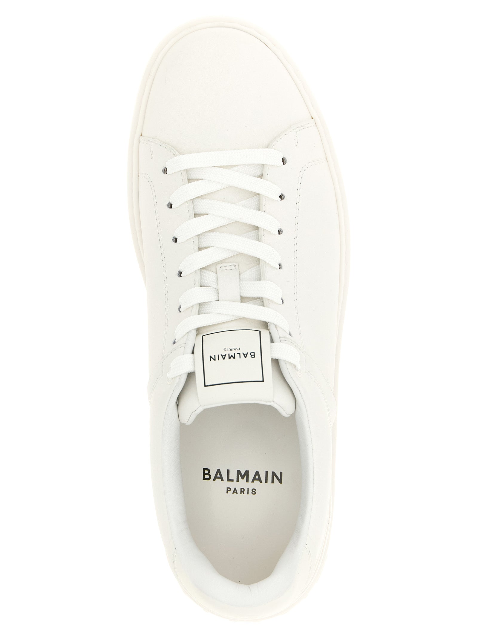 Elevate your style with Balmain's White Calfskin Low Top Sneakers, a fusion of elegance and modernity crafted from pure calf leather for the discerning individual.