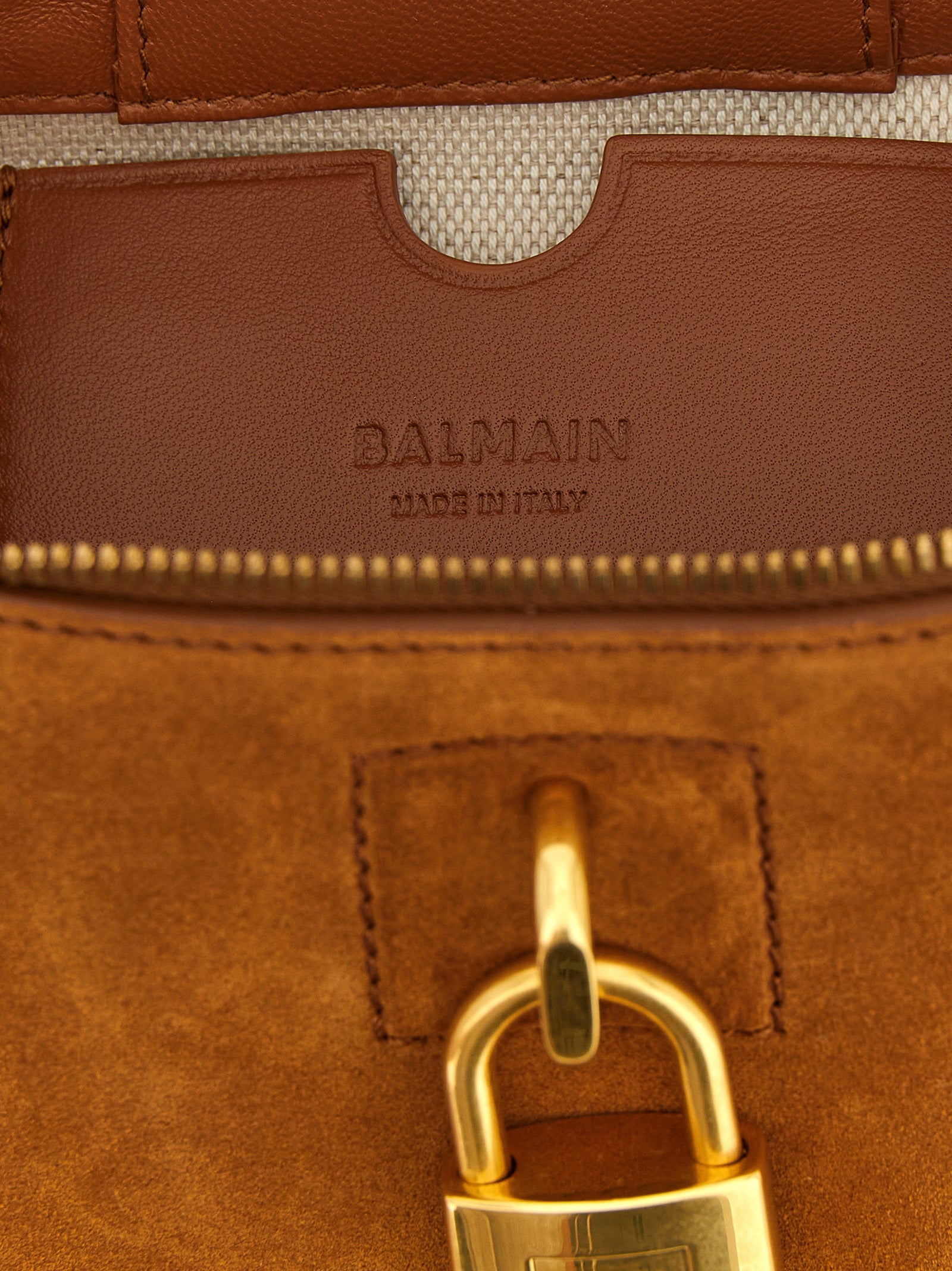 Indulge in the exquisite allure of Balmain's Pulse Vanity handbag, where Italian craftsmanship meets sumptuous brown calfskin, embodying modern elegance and prestige.