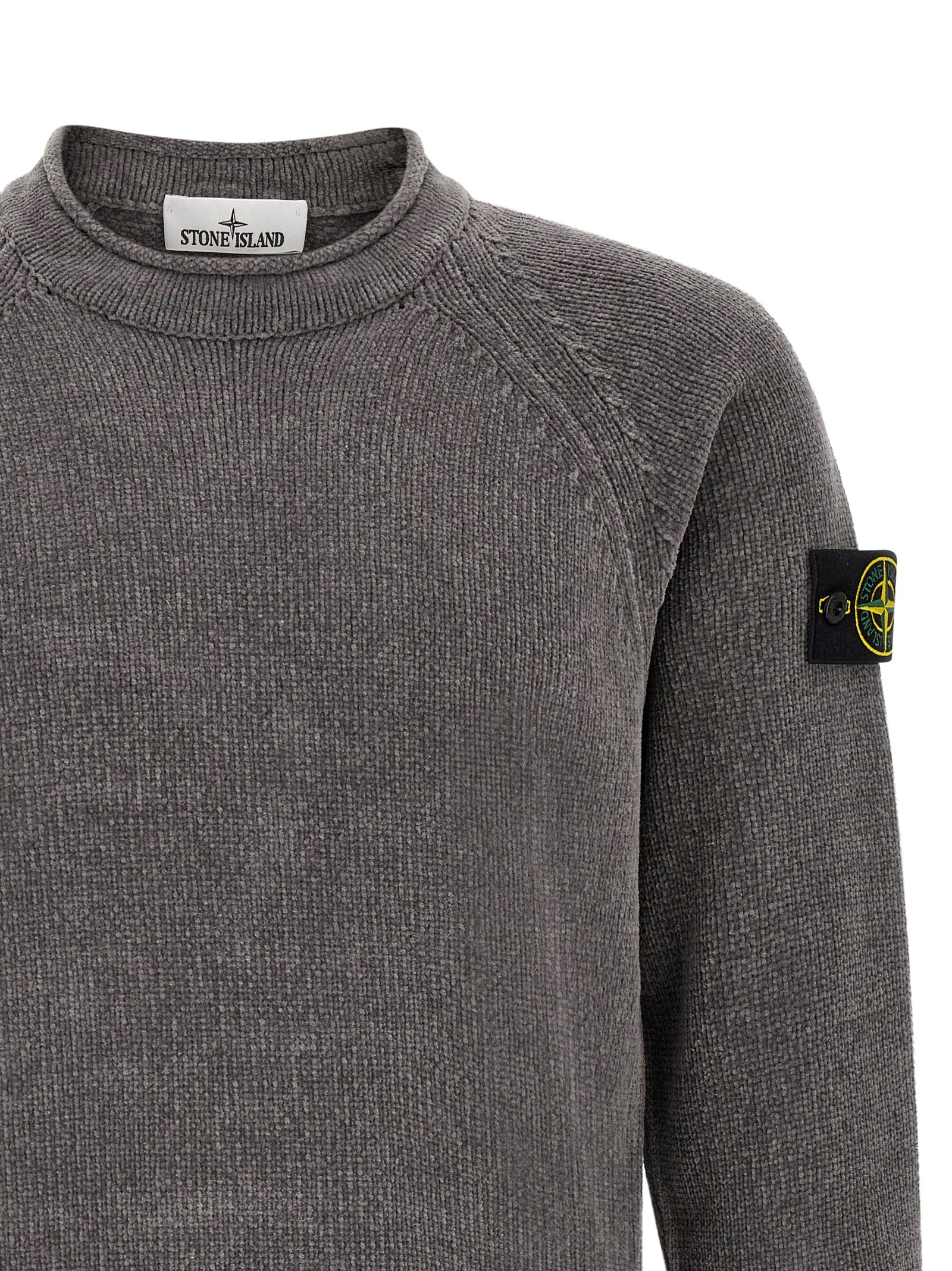 Elevate your wardrobe with the Stone Island Gray Cotton Cardigan, a masterpiece of contemporary knitwear crafted from luxurious mouliné cotton chenille, embodying refined elegance and timeless style.