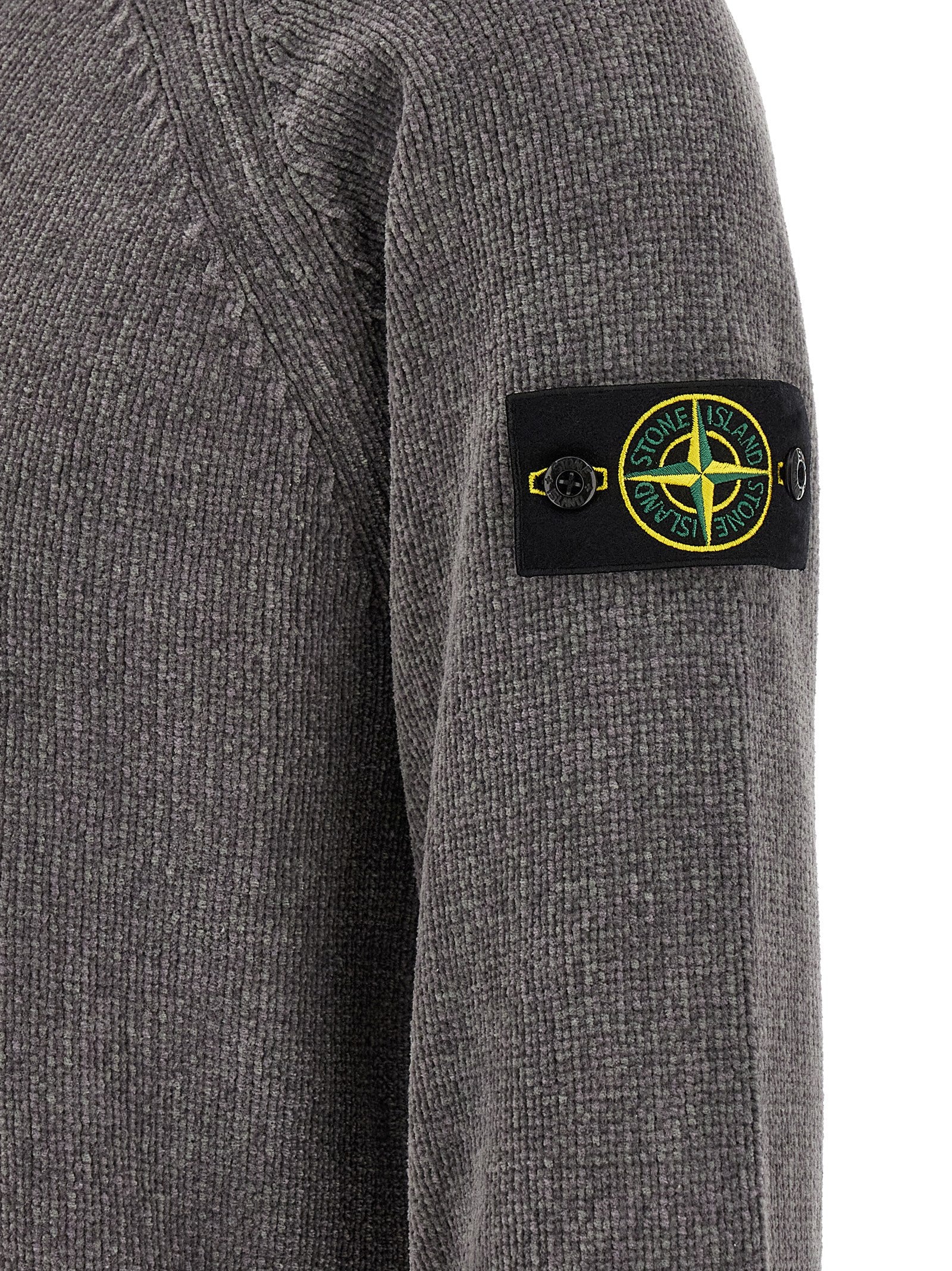 Elevate your wardrobe with the Stone Island Gray Cotton Cardigan, a masterpiece of contemporary knitwear crafted from fine mouliné cotton chenille, embodying luxury and sophistication.