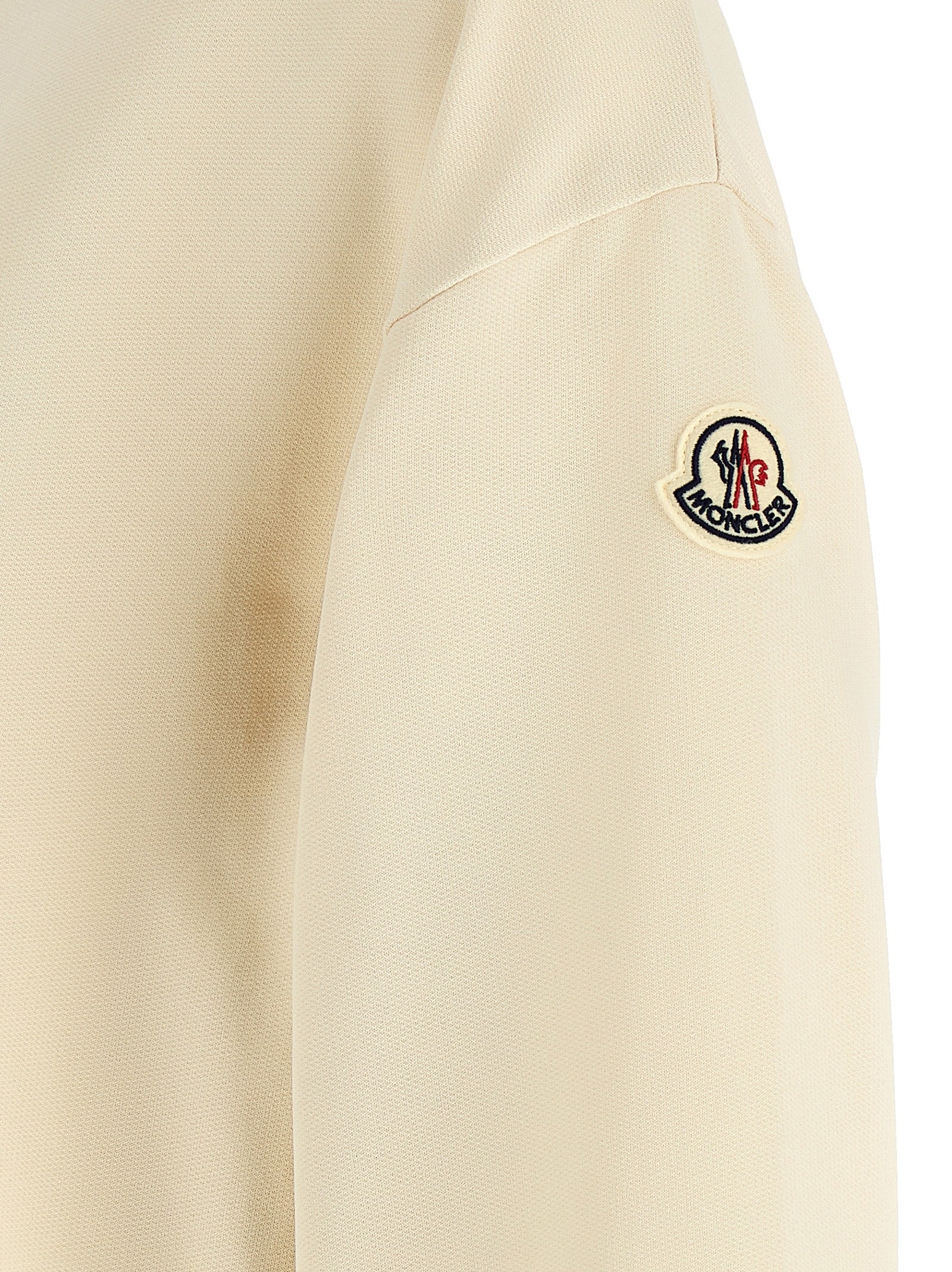 Elevate your casualwear with the Moncler Beige Cotton Sweatshirt, a masterpiece of brushed cotton and elegant design, embodying luxury and effortless style.