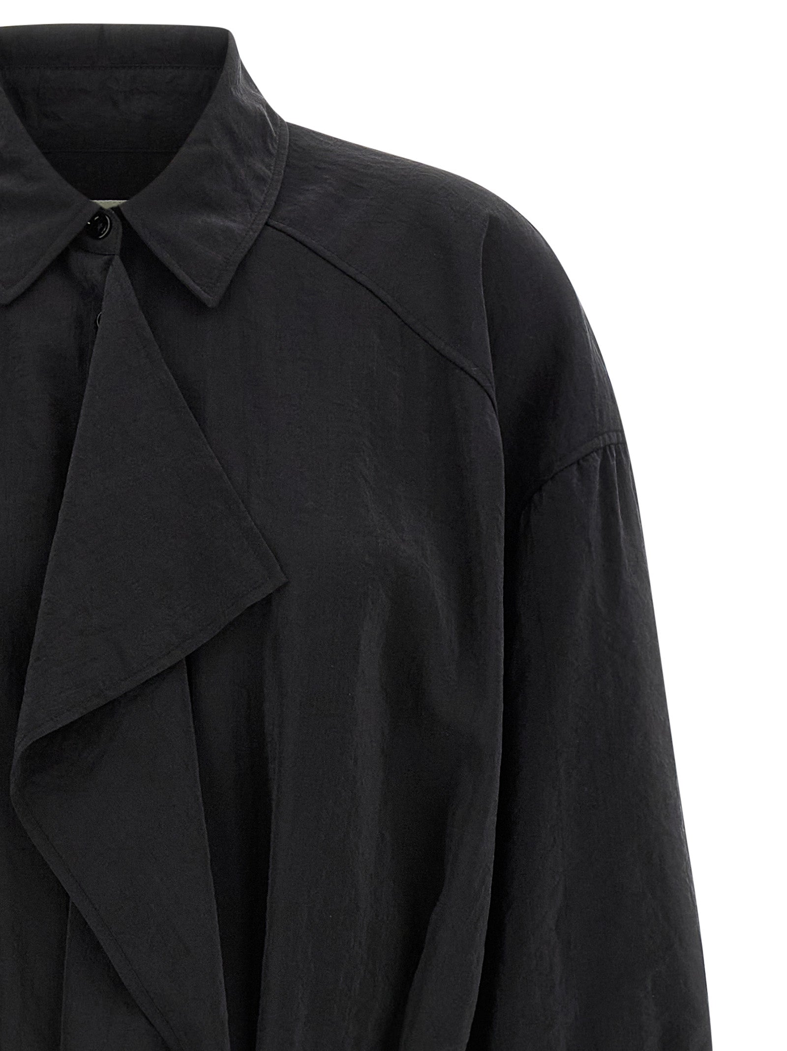 Indulge in the Lemaire Black Silk Midi Dress, a masterpiece of luxurious craftsmanship and edgy elegance, perfect for making a bold statement in any setting.