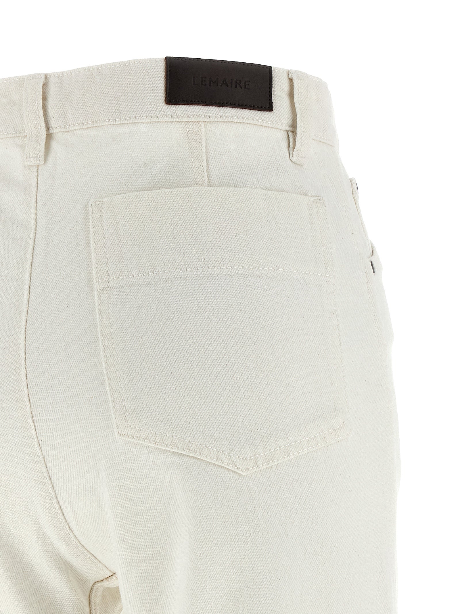 Elevate your wardrobe with Lemaire's White Cotton High-Waisted Jean, a fusion of sophisticated design and exquisite craftsmanship for the discerning individual.