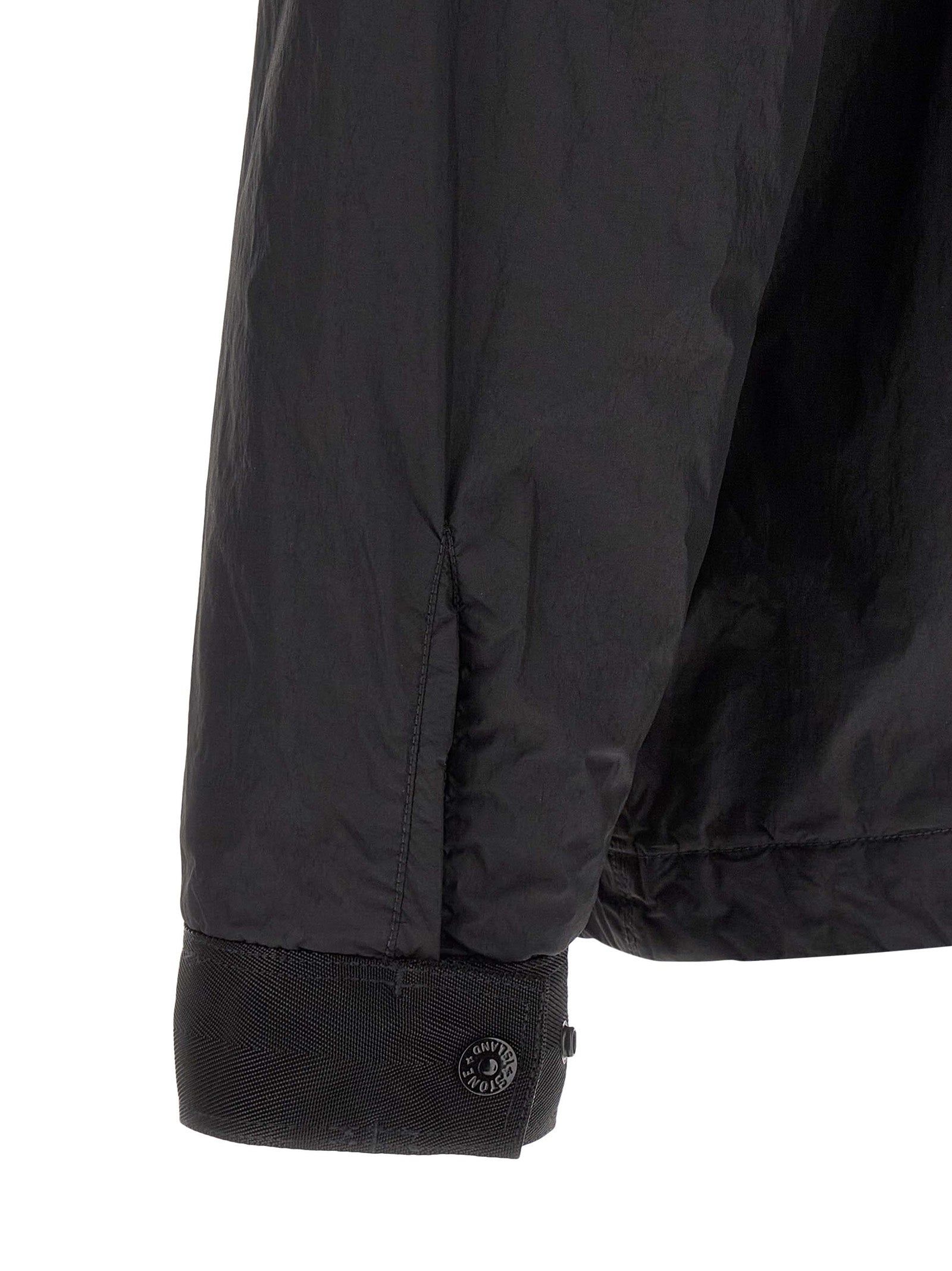 Discover the Stone Island Black Polyamide Shell Jacket, a masterpiece of lightweight luxury, blending style and sustainability for the discerning individual.