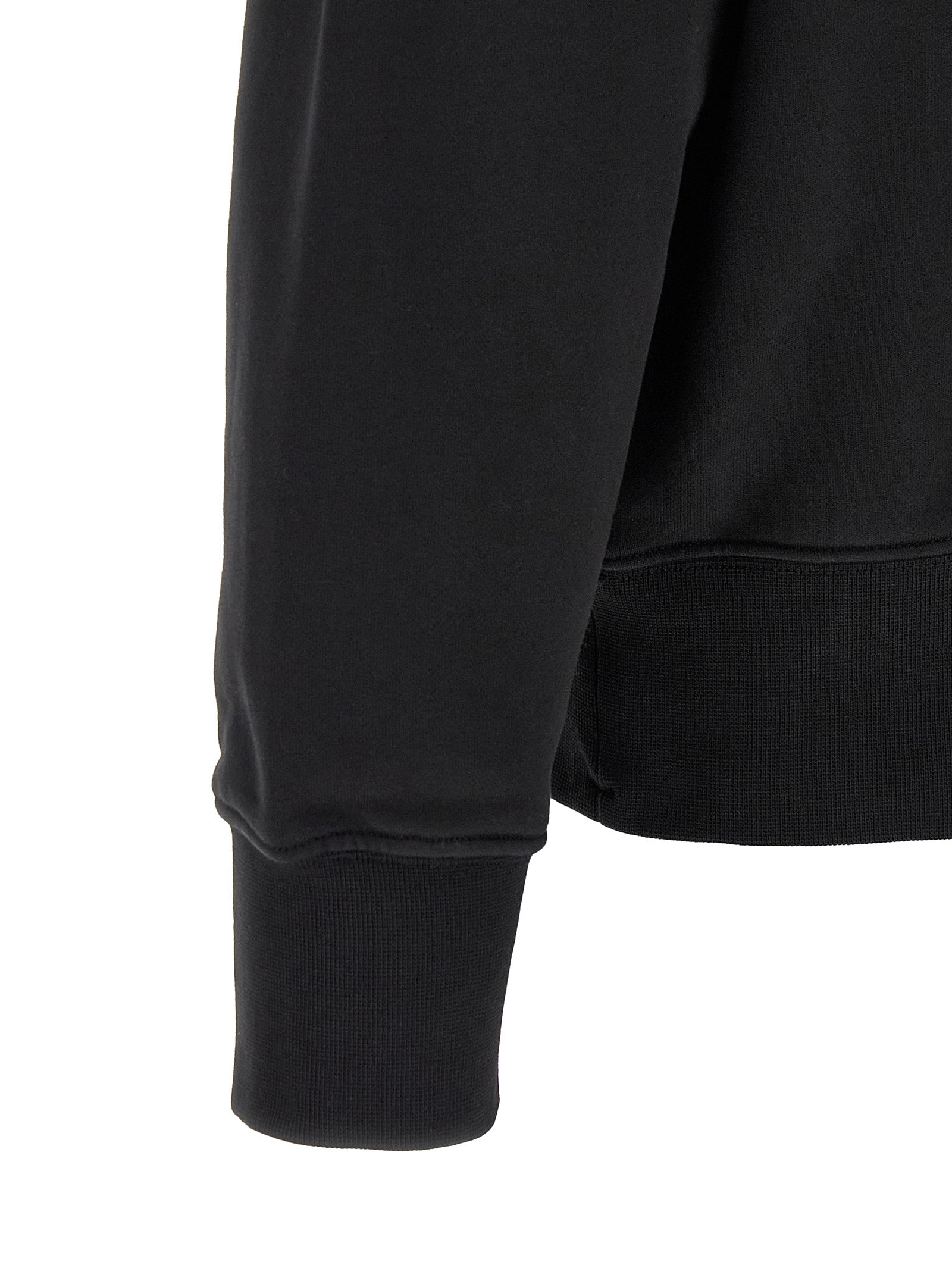 Indulge in the Stone Island Black Cotton Sweatshirt, a pinnacle of sustainable luxury crafted from organic cotton, merging comfort with iconic style for the discerning individual.