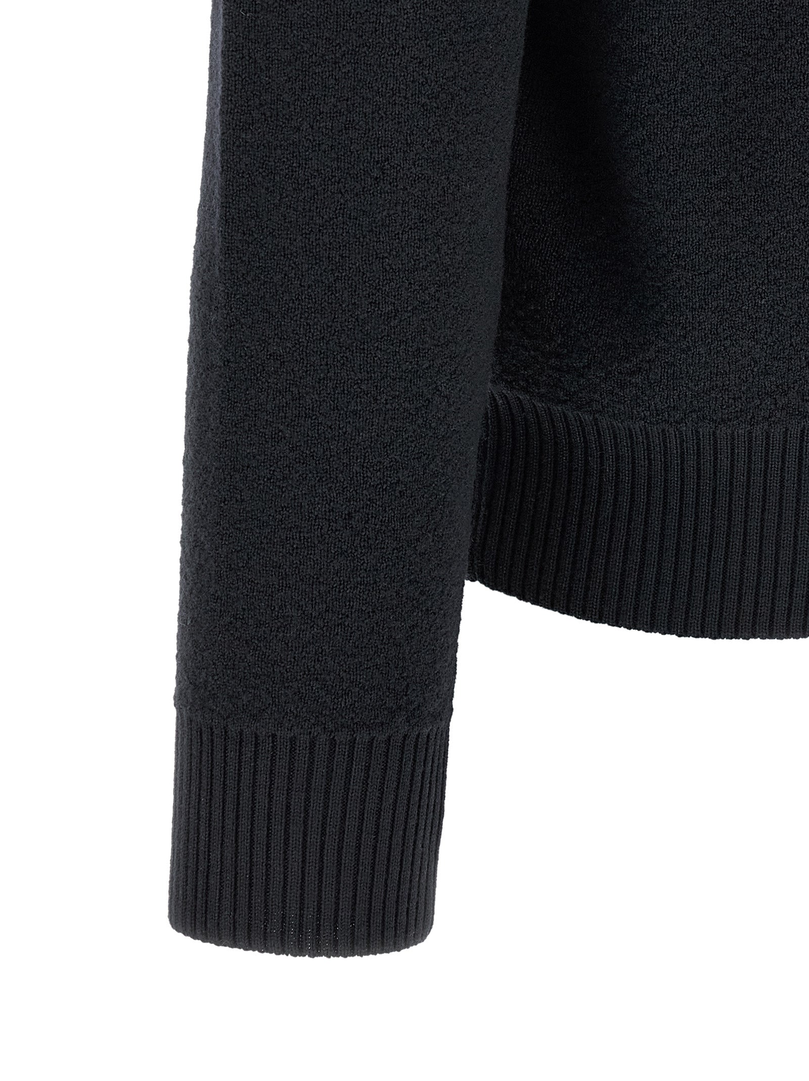 Elevate your style with the Stone Island Blue Virgin Wool Cardigan, a masterpiece of craftsmanship and luxury that embodies sophistication and timeless elegance.