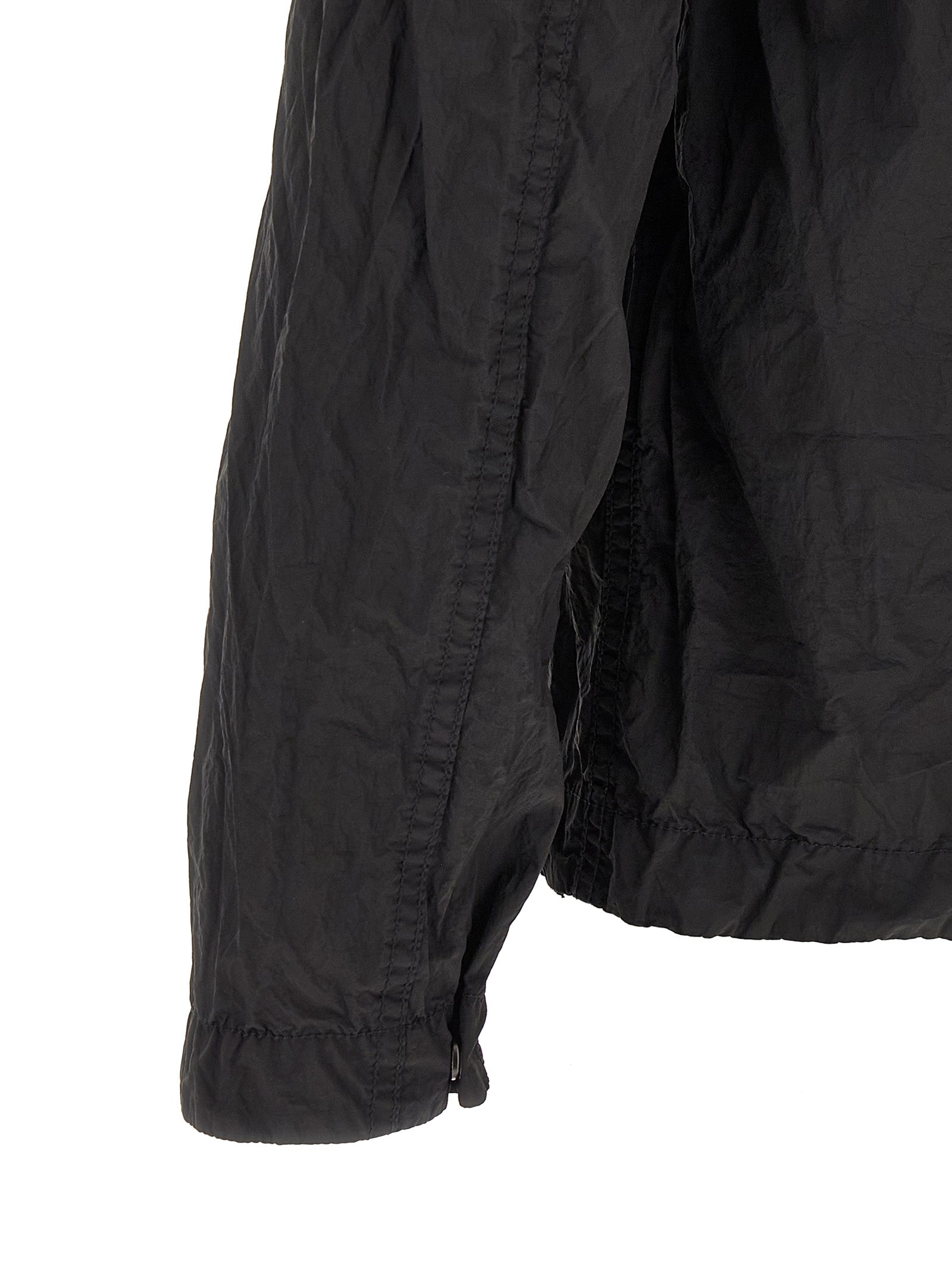 Discover the Stone Island Black Polyamide Blouse, a blend of sustainable luxury and urban elegance, crafted from ECONYL® yarn for the discerning individual.