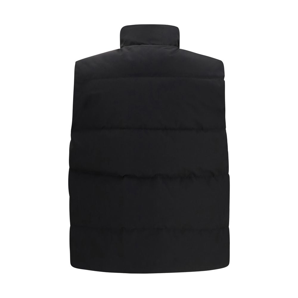 Elevate your wardrobe with the Canada Goose Black Recycled Polyester Sleeveless Jacket, a fusion of sustainable luxury and timeless design, perfect for the discerning individual.