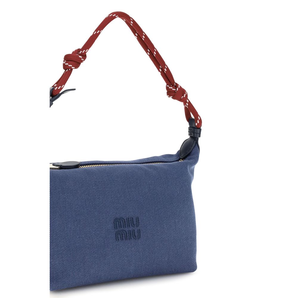 Elevate your style with the Miu Miu Blue Cotton Shoulder Bag, a masterpiece of elegance and functionality, perfect for those who appreciate refined luxury.