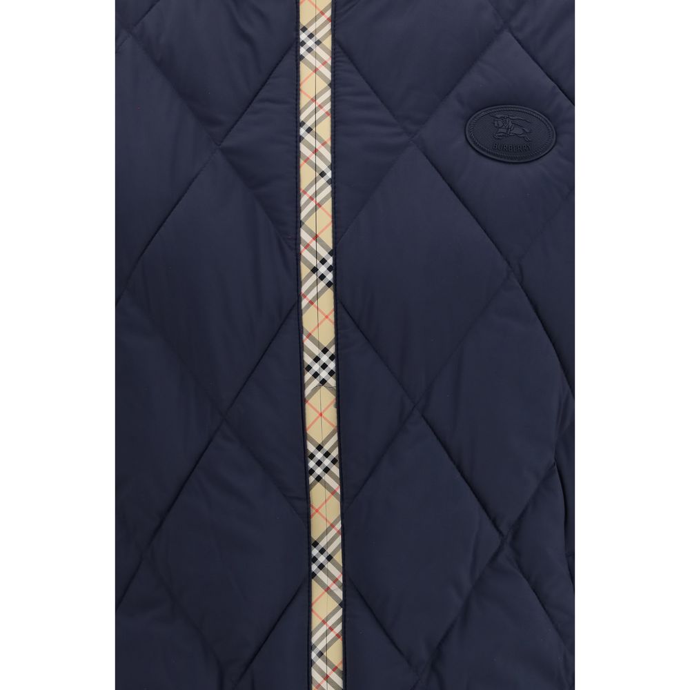 Discover the Burberry Blue Polyamide Sleeveless Jacket, a masterpiece of craftsmanship featuring a padded design and iconic details, perfect for the discerning individual.