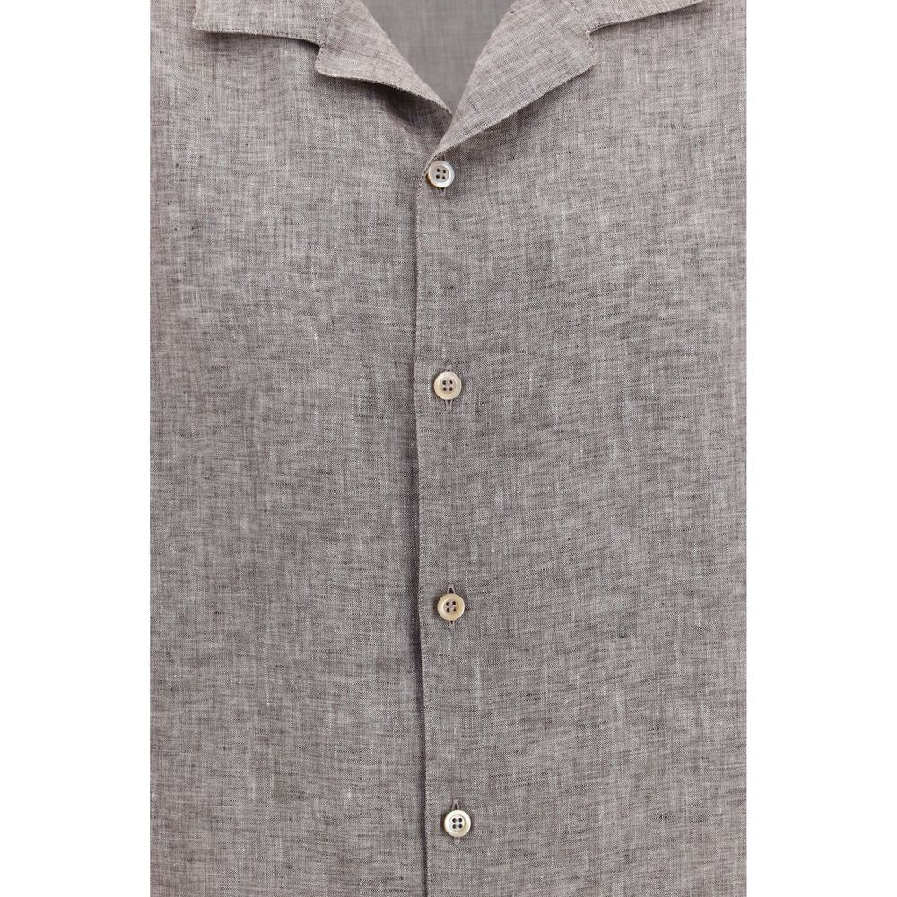 Elevate your warm-weather wardrobe with the Brunello Cucinelli Gray Linen Shortsleeve Shirt, a masterpiece of breathable linen that embodies effortless luxury and refined style.