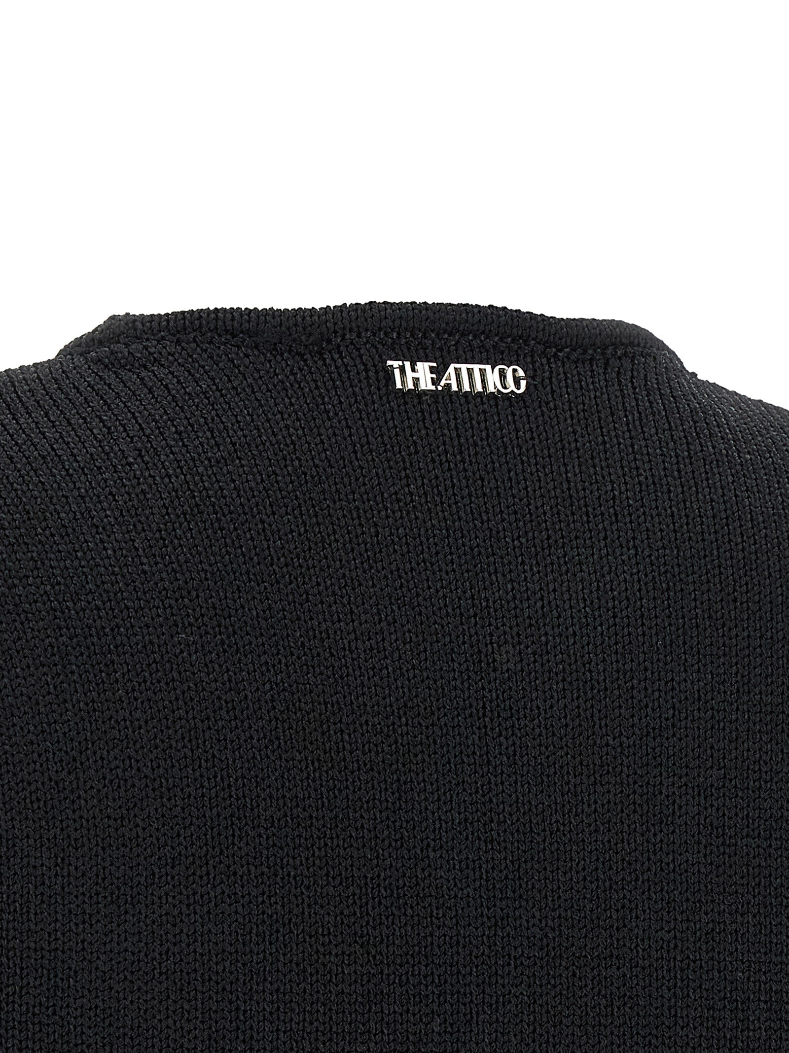 Experience the allure of The Attico Black Viscose Short Dress, a masterpiece of Italian craftsmanship that embodies sophistication and edgy elegance for the discerning fashion connoisseur.