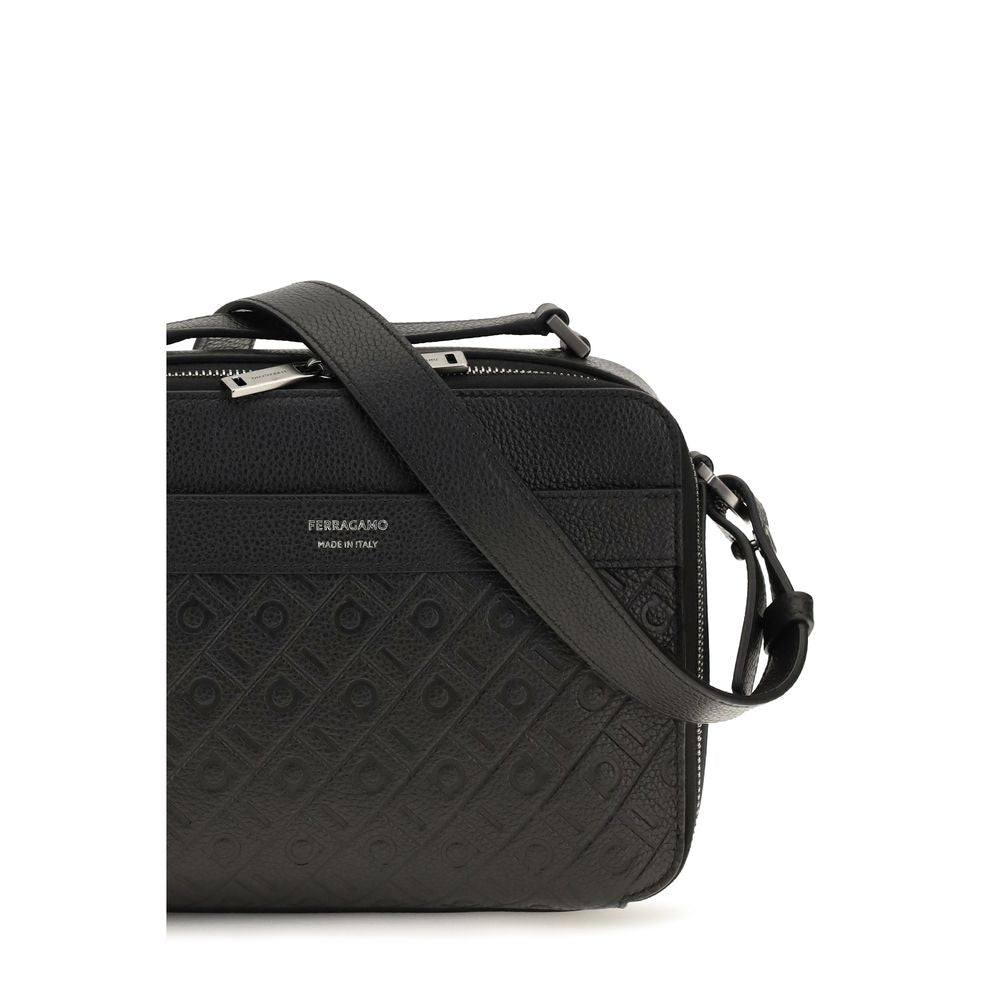 Indulge in the timeless elegance of the Ferragamo Black Calf Leather Bos Taurus Shoulder Bag, a masterpiece of grained leather and embossed Gancini pattern, perfect for the discerning individual.