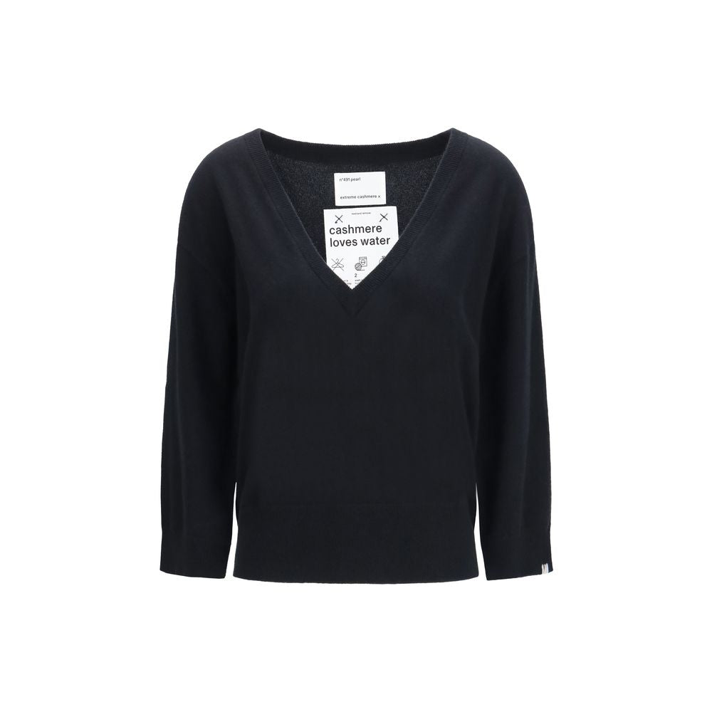 Indulge in the timeless elegance of the Extreme Cashmere Black Cashmere Sweater, a luxurious knit crafted from soft cashmere, perfect for any occasion.