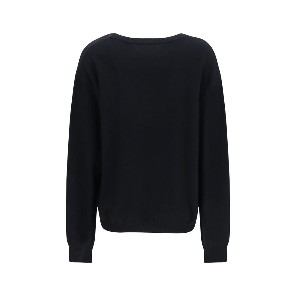 Indulge in the timeless elegance of the Extreme Cashmere Black Cashmere Sweater, crafted from pure cashmere for a refined wardrobe staple that exudes luxury.