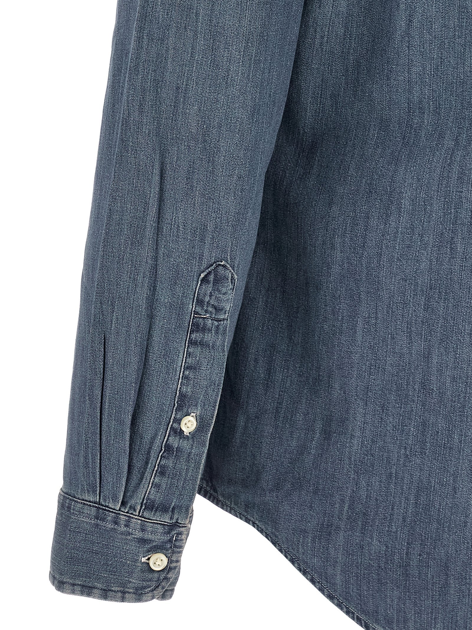 Elevate your wardrobe with the Polo Ralph Lauren Blue Cotton Blouse, a timeless piece crafted from pure cotton denim, embodying casual elegance and superior comfort.