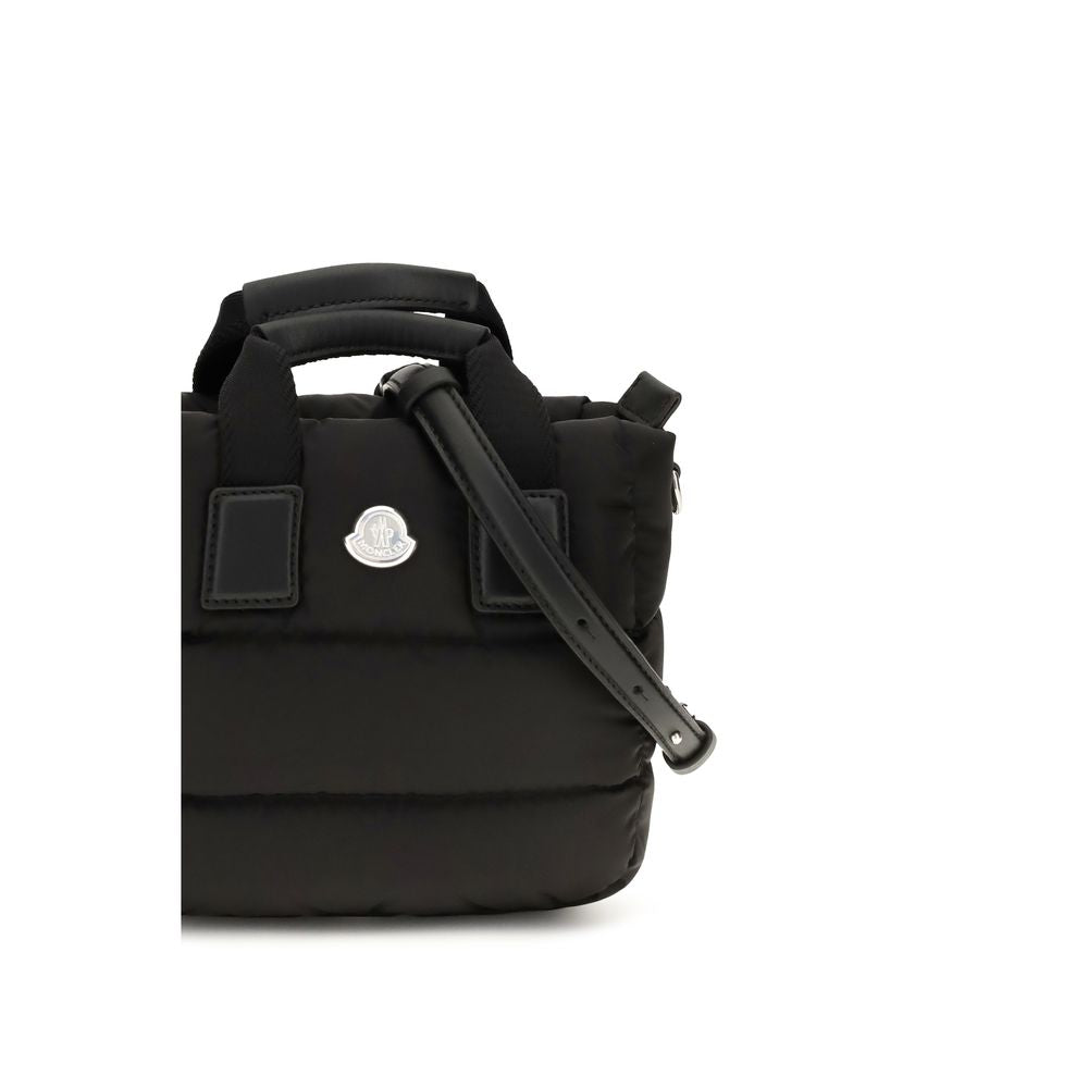 Discover the Moncler Black Nylon Shoulder Bag, a fusion of exquisite craftsmanship and iconic design, perfect for those who embrace luxury and sophistication.
