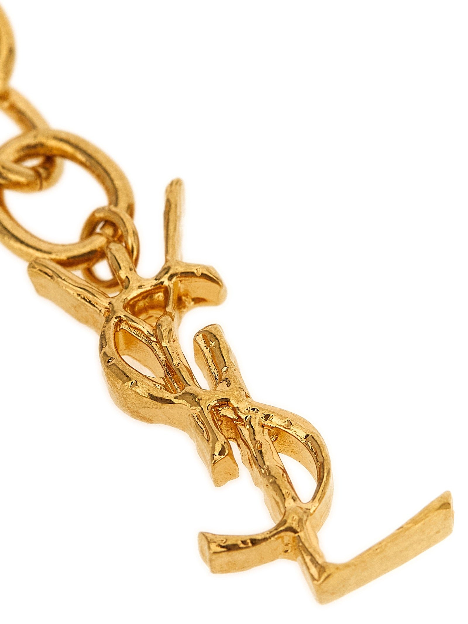 Discover the Saint Laurent Gold Brass Bracelet, a masterpiece of woven mesh and wave embossed elegance, elevating your style with timeless luxury and sophistication.
