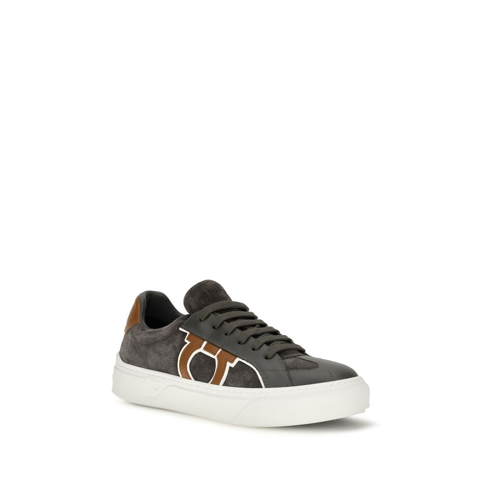 Elevate your style with Ferragamo's Gancini Sneakers, crafted from luxurious suede and smooth calf leather, embodying Italian craftsmanship and timeless elegance.