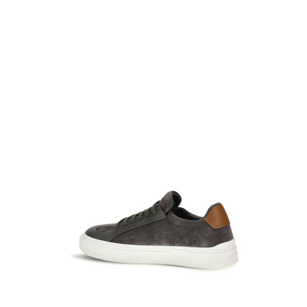 Experience the allure of Ferragamo's Gray Suede Leather Low Top Sneakers, where exquisite craftsmanship meets contemporary elegance, embodying timeless luxury for discerning tastes.