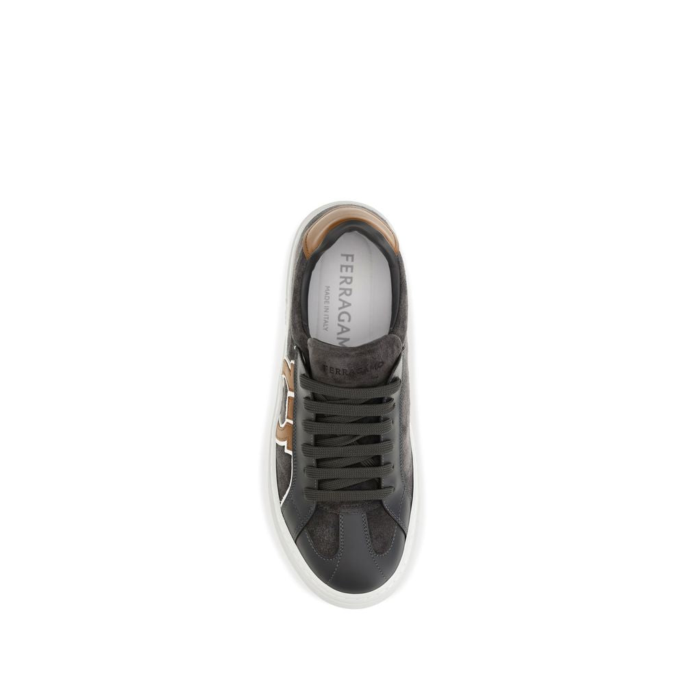 Elevate your style with Ferragamo's Gancini Sneakers, crafted from sumptuous suede and leather, embodying Italian artistry and modern elegance for the discerning individual.