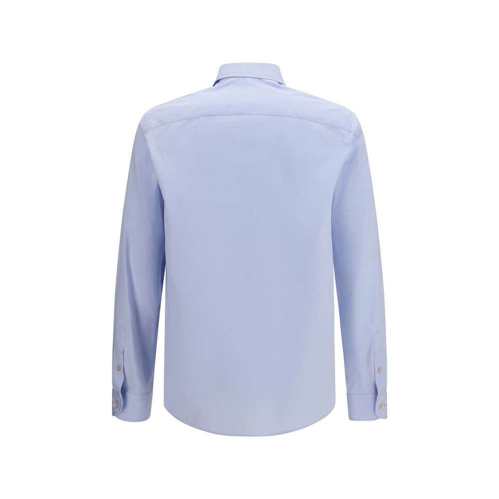 Indulge in the exquisite Valentino Garavani Blue Cotton Dress Shirt, a masterpiece of soft cotton and butterfly embroidery, embodying timeless elegance and refined sophistication.