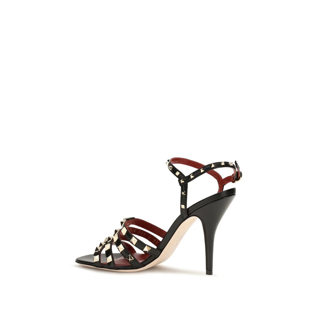 Elevate your elegance with Valentino Garavani's Black Goatskin Stiletto Heel Sandals, where exquisite craftsmanship meets iconic design, perfect for every sophisticated silhouette.
