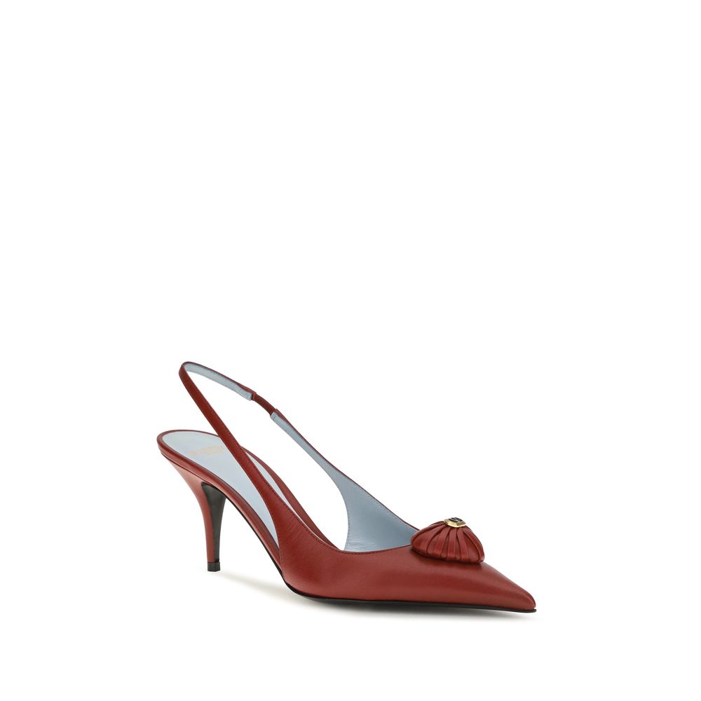 Experience the allure of Valentino Garavani's Coeur Royal Slingback Pumps, crafted from exquisite calf leather, embodying elegance and romance for the discerning connoisseur.