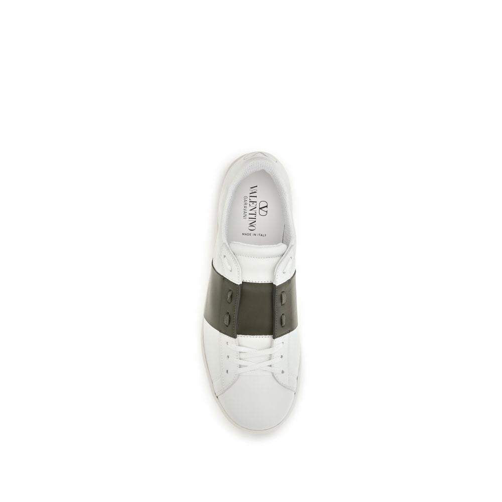 Elevate your style with Valentino Garavani's White Calf Leather Bos Taurus Low Top Sneakers, where timeless design meets luxurious comfort, perfect for the discerning individual.