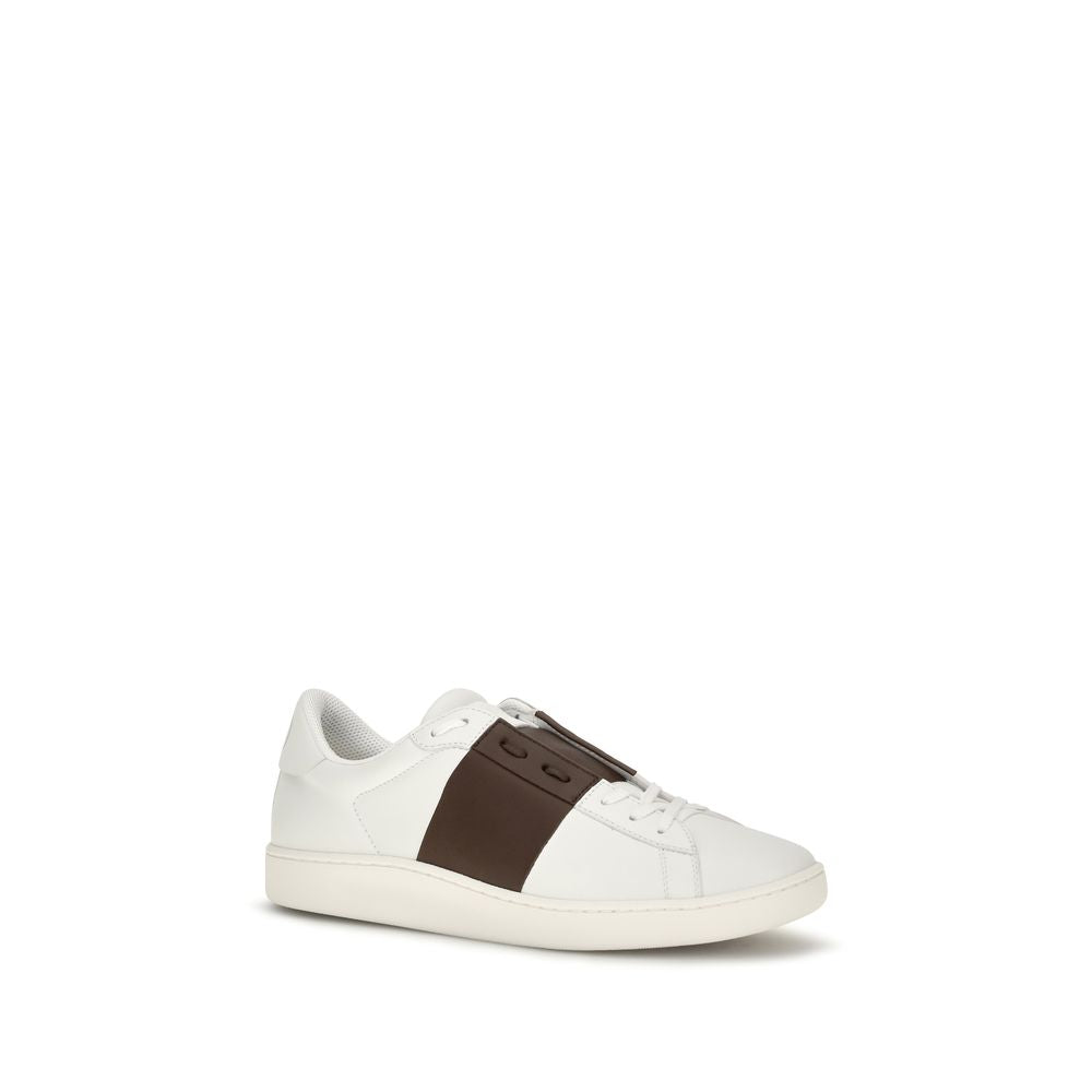 Indulge in the timeless elegance of Valentino Garavani White Calf Leather Bos Taurus Low Top Sneakers, where exquisite craftsmanship meets iconic style for the discerning individual.