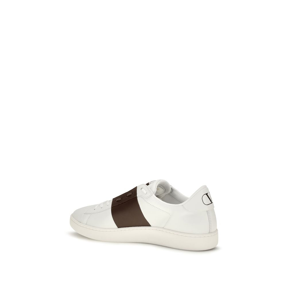 Indulge in the timeless elegance of Valentino Garavani's White Calf Leather Bos Taurus Low Top Sneakers, where exquisite craftsmanship meets iconic style for the discerning connoisseur.