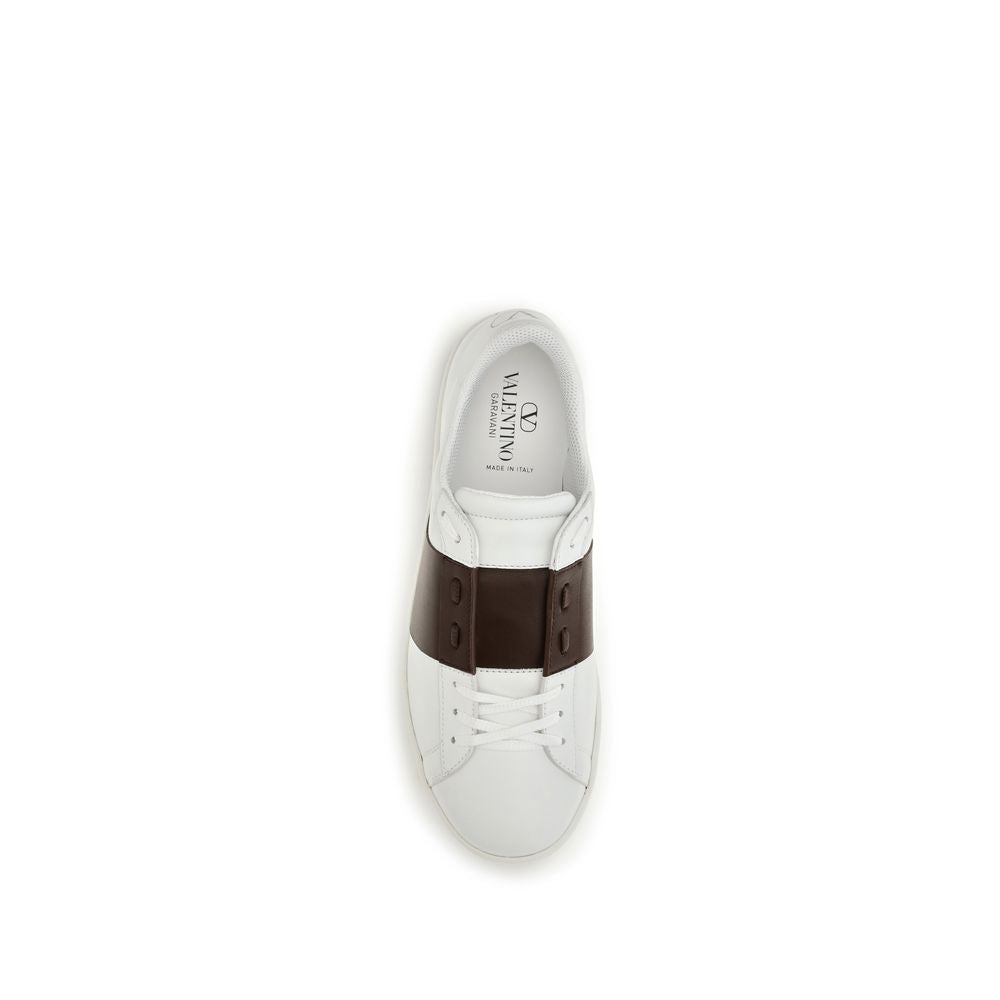Elevate your style with Valentino Garavani's White Calf Leather Bos Taurus Low Top Sneakers, where timeless craftsmanship meets bold sophistication for the discerning individual.